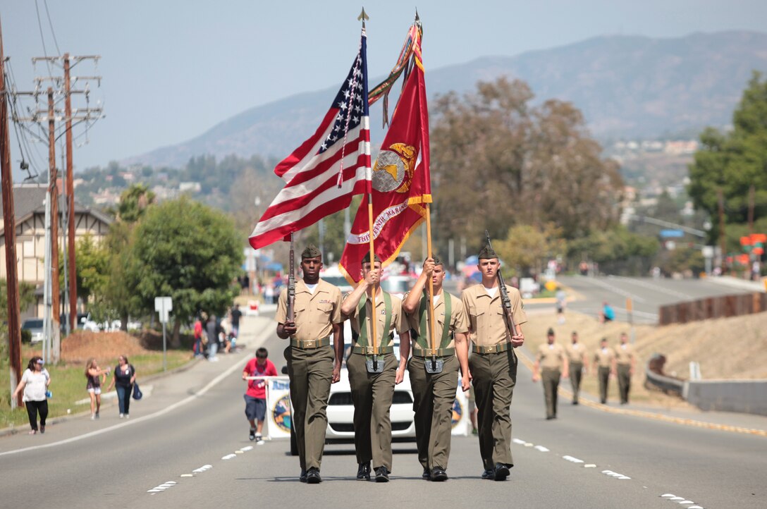 The 13th Marine Expeditionary Unit Color Guard marches down East Santa Anna Canyon Road during the Anaheim Independence Day Parade, July 4, 2012. The 13th MEU Color Guard and a platoon-size formation of Marines and Sailors marched throughout the streets, led by Col. Christopher D. Taylor, commanding officer of the 13th MEU and Grand Marshall of the Parade. The City of Anaheim adopted the unit in October 2007 and its Adoption Committee has since supported the MEU in numerous ways including, gift baskets for new parents, ball fundraising and their annual Christmas party. 
(Official Marine Corps photo by Sgt. Christopher O’Quin/Released) 

