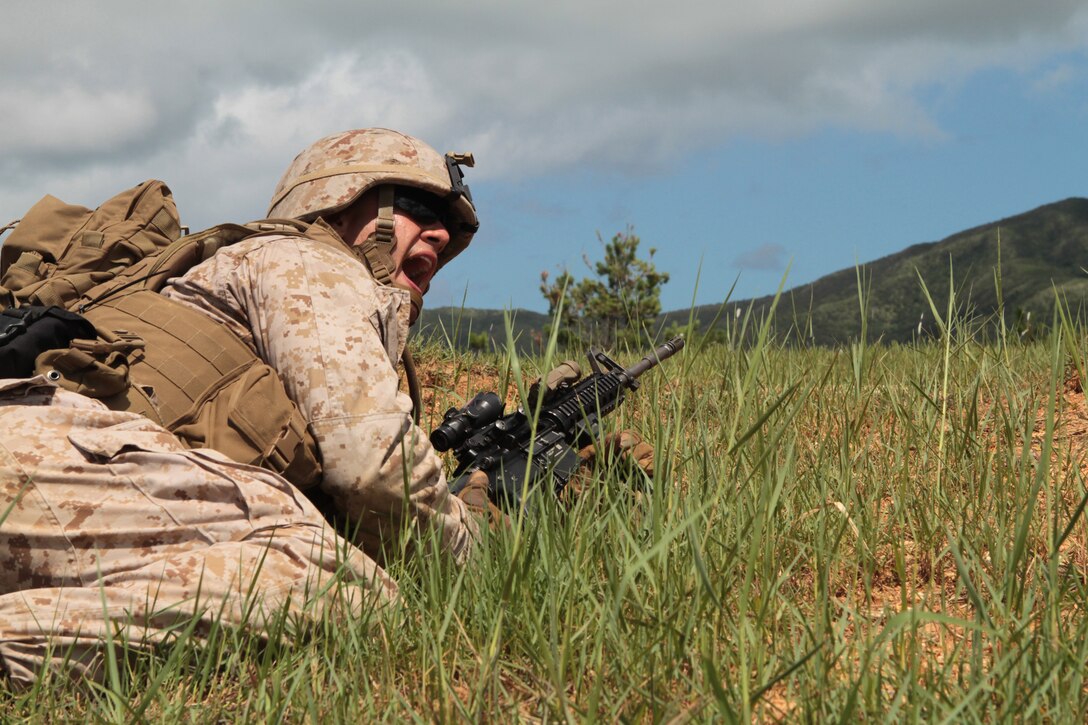 Lance Cpl. Errol Oskay, a fire team leader with Battalion Landing Team 2nd Battalion, 1st Marine Regiment, 31st Marine Expeditionary Unit screams instructions to his team during fire and maneuver training here, July 23. The 31st MEU is the Marine Corps' force in readiness for the Asia Pacific region.