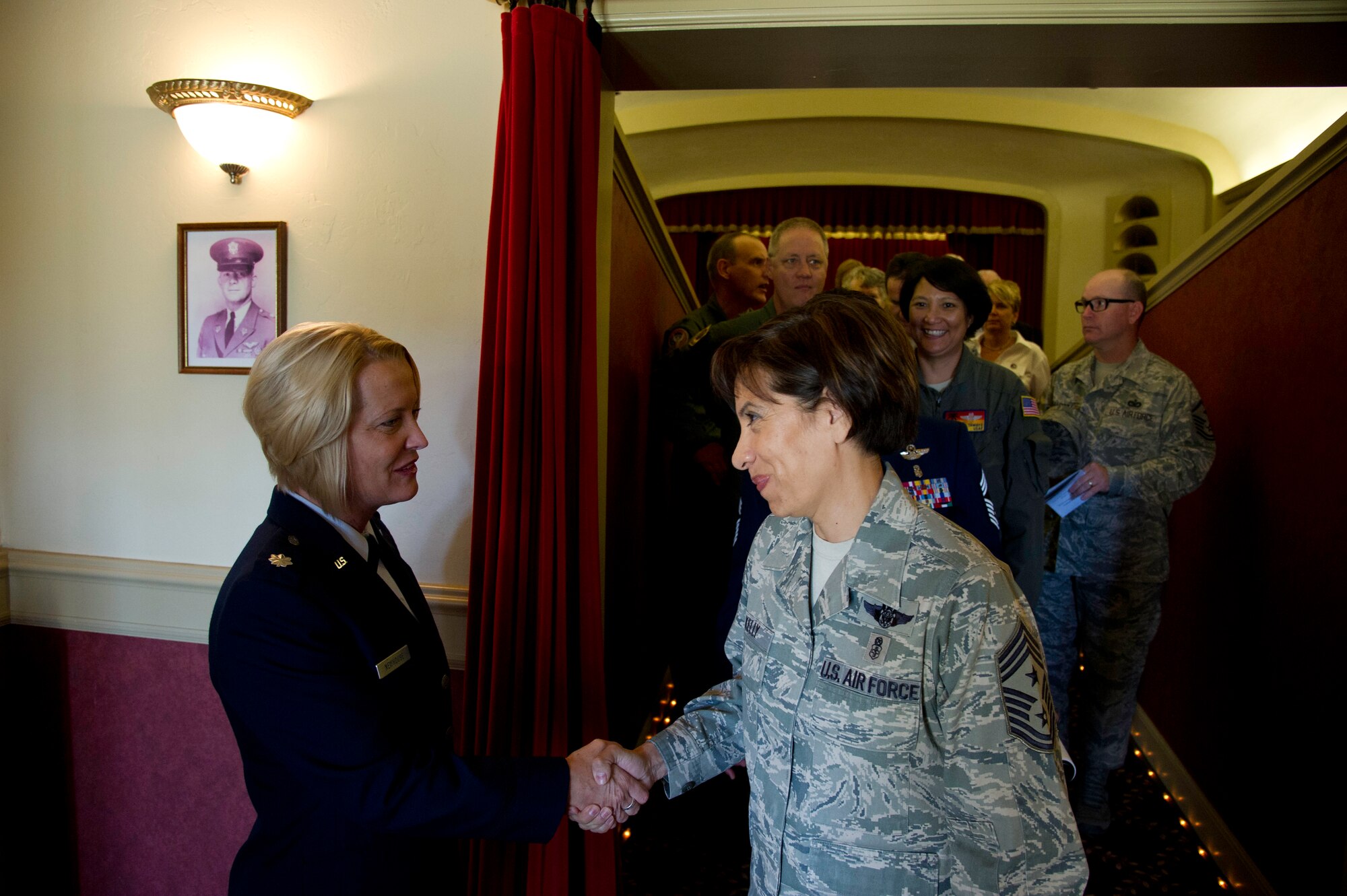Lt. Col. Carolyn Newhouse takes command of the 452d Aeromedical Evacuation Squadron on July 21 during an assumption of command ceremony in the Cultural Resource Center. Col. Mark Sigler, 452d Operations Group commander, was the presiding officer for the event. (U.S. Air Force photo by Staff Sgt. Matthew Smith)