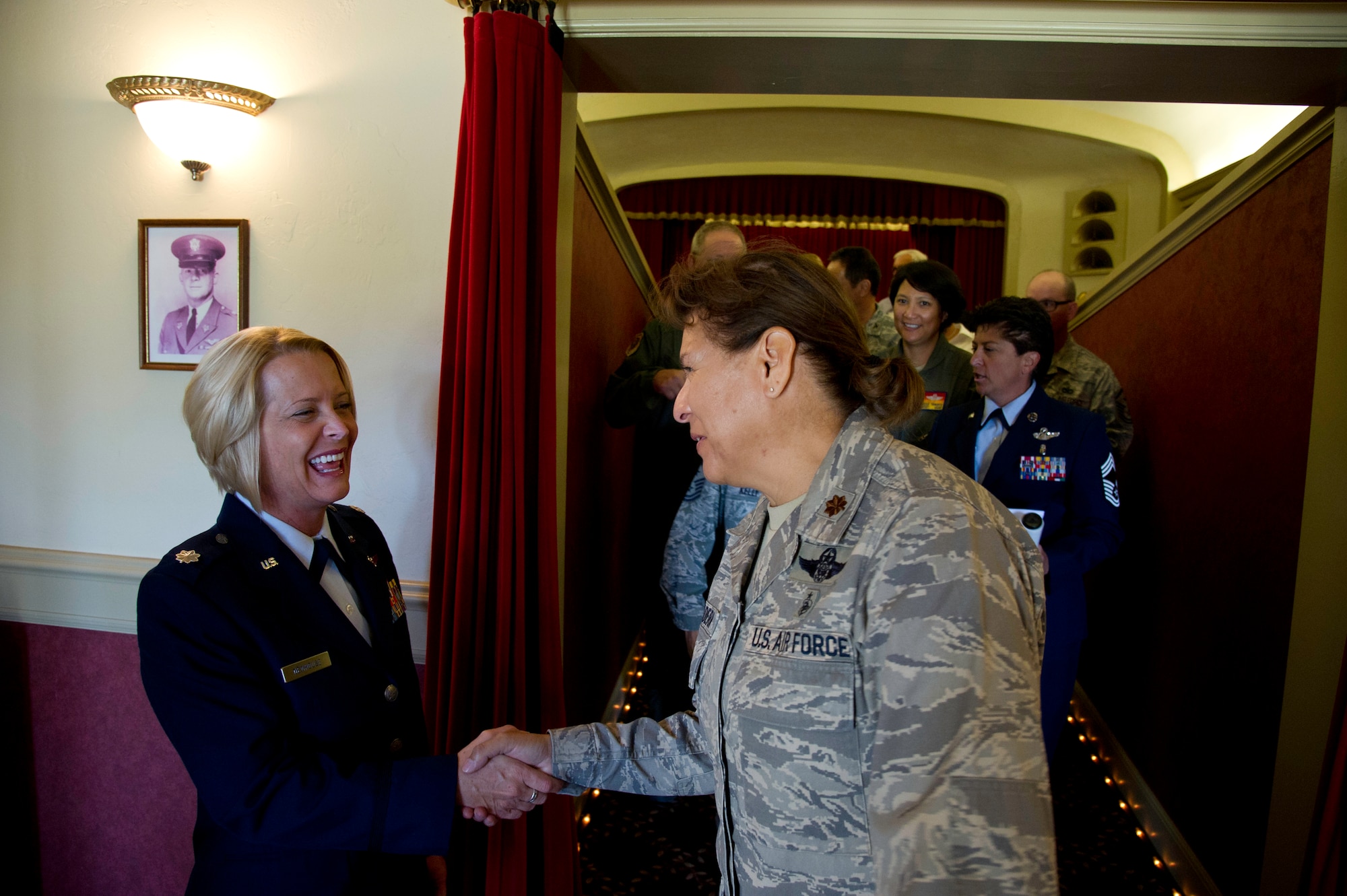Lt. Col. Carolyn Newhouse takes command of the 452d Aeromedical Evacuation Squadron on July 21 during an assumption of command ceremony in the Cultural Resource Center. Col. Mark Sigler, 452d Operations Group commander, was the presiding officer for the event. (U.S. Air Force photo by Staff Sgt. Matthew Smith)