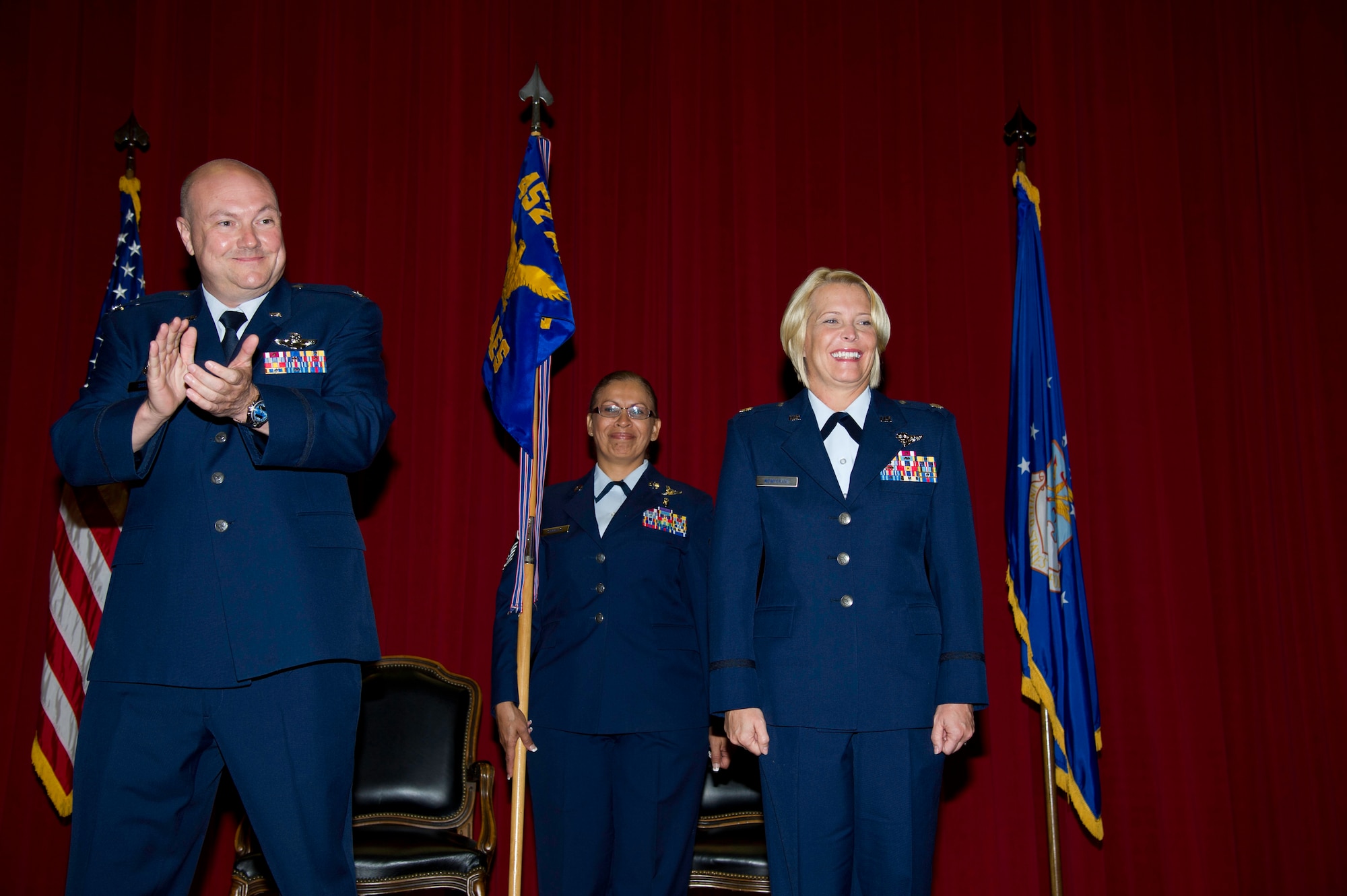 Lt. Col. Carolyn Newhouse takes command of the 452d Aeromedical Evacuation Squadron on July 21 during an assumption of command ceremony in the Cultural Resource Center. Col. Mark Sigler, 452d Operations Group commander, was the presiding officer for the event. (U.S. Air Force photo by Staff Sgt. Matthew Smith)
