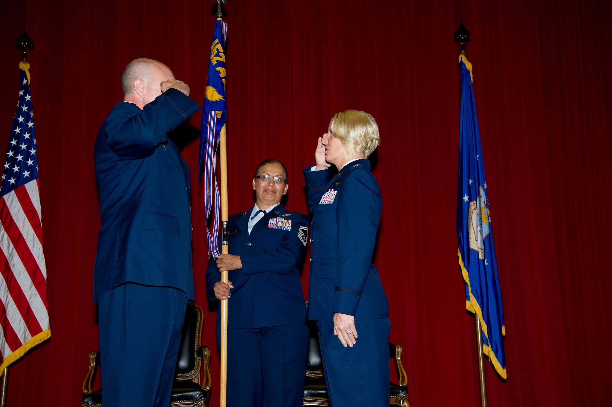 Lt. Col. Carolyn Newhouse takes command of the 452d Aeromedical Evacuation Squadron on July 21 during an assumption of command ceremony in the Cultural Resource Center. Col. Mark Sigler, 452d Operations Group commander, was the presiding officer for the event. (U.S. Air Force photo by Staff Sgt. Matthew Smith)