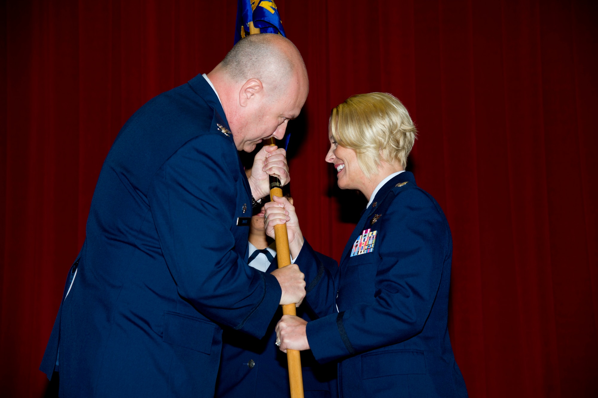 Lt. Col. Carolyn Newhouse takes command of the 452d Aeromedical Evacuation Squadron on July 21 during an assumption of command ceremony in the Cultural Resource Center. Col. Mark Sigler, 452d Operations Group commander, was the presiding officer for the event. (U.S. Air Force photo by Staff Sgt. Matthew Smith)