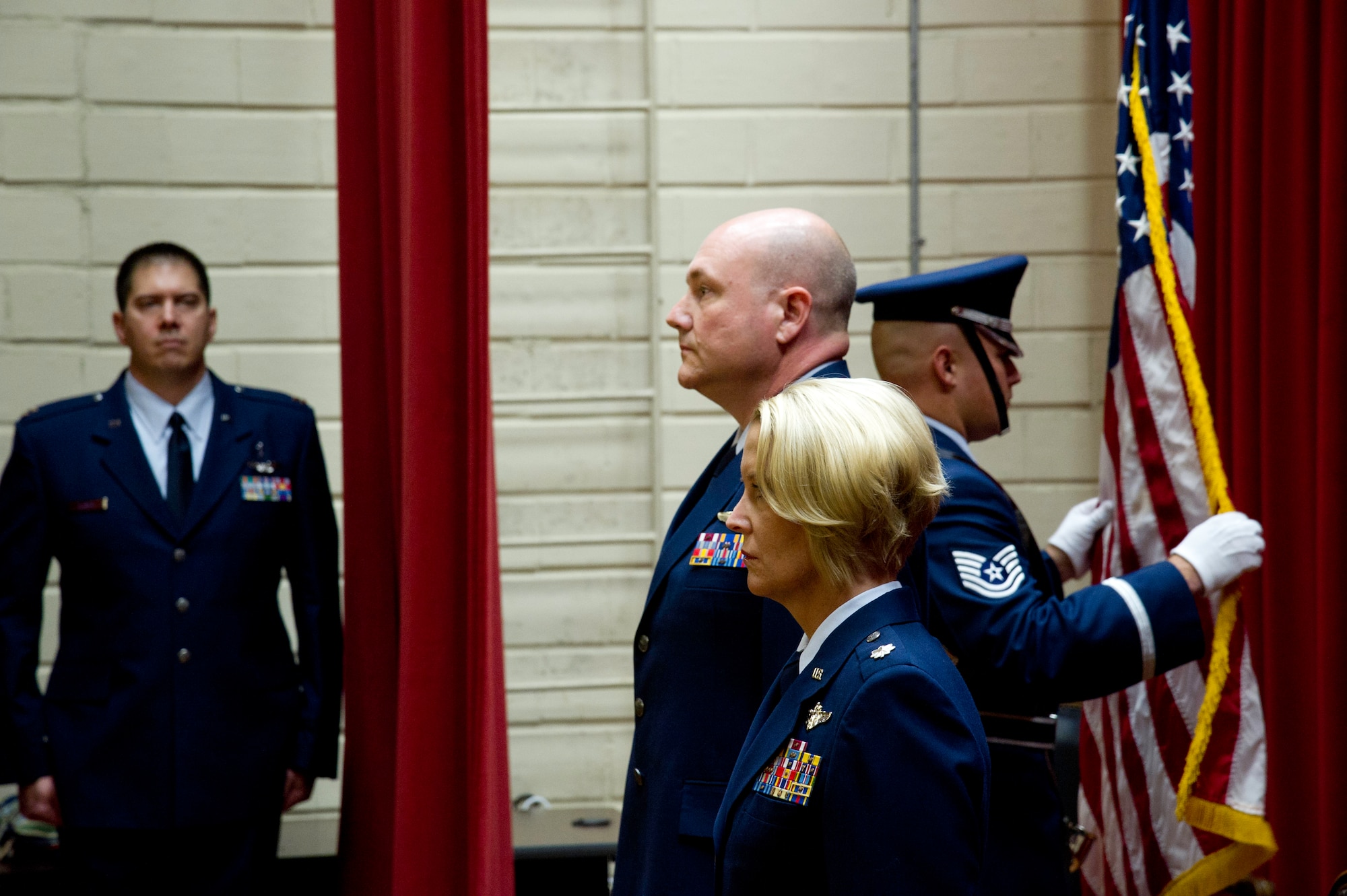 Lt. Col. Carolyn Newhouse takes command of the 452d Aeromedical Evacuation Squadron on July 21 during an assumption of command ceremony in the Cultural Resource Center. Col. Mark Sigler, 452d Operations Group commander, was the presiding officer for the event. (U.S. Air Force photo by Staff Sgt. Matthew Smith)