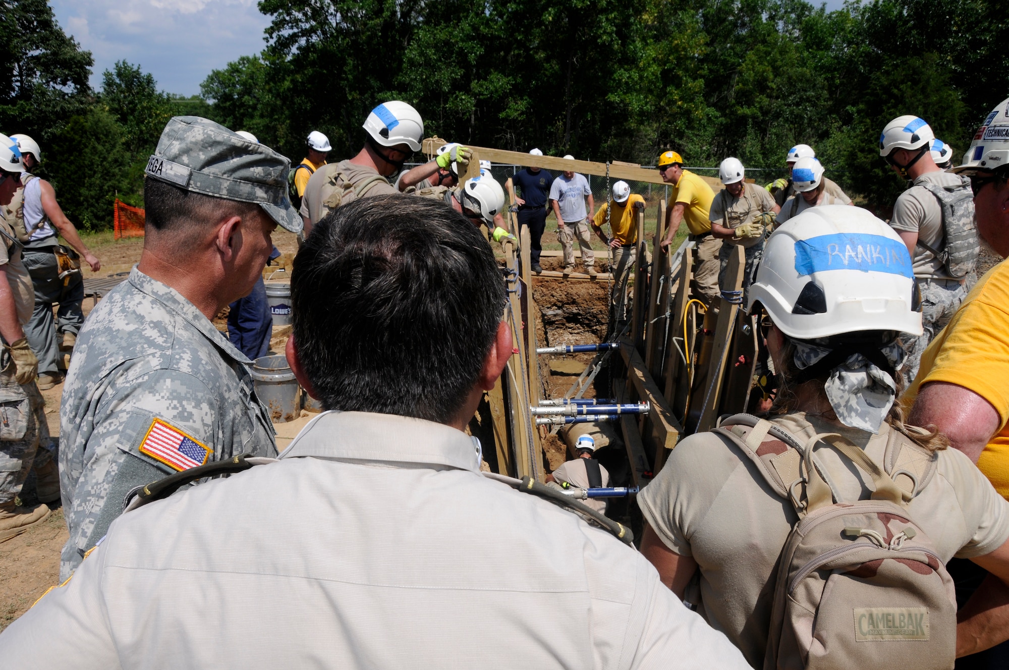 Guatemalan military leaders observe Urban Search and Rescue training at the 188th Fighter Wing July 11 as part of the National Guard's State Partnership Program (SPP). The 65-nation, 20-year-old program provides unique partnership capacity-building capabilities to combatant commanders and U.S. ambassadors through partnerships between U.S. states, territories and the District of Columbia and foreign countries. The SPP supports U.S. national interests and security cooperation goals by engaging partner nations via military, socio-political and economic conduits at the local, state and national level. (National Guard photo by Airman 1st Class Hannah Landeros/188th Fighter Wing Public Affairs)