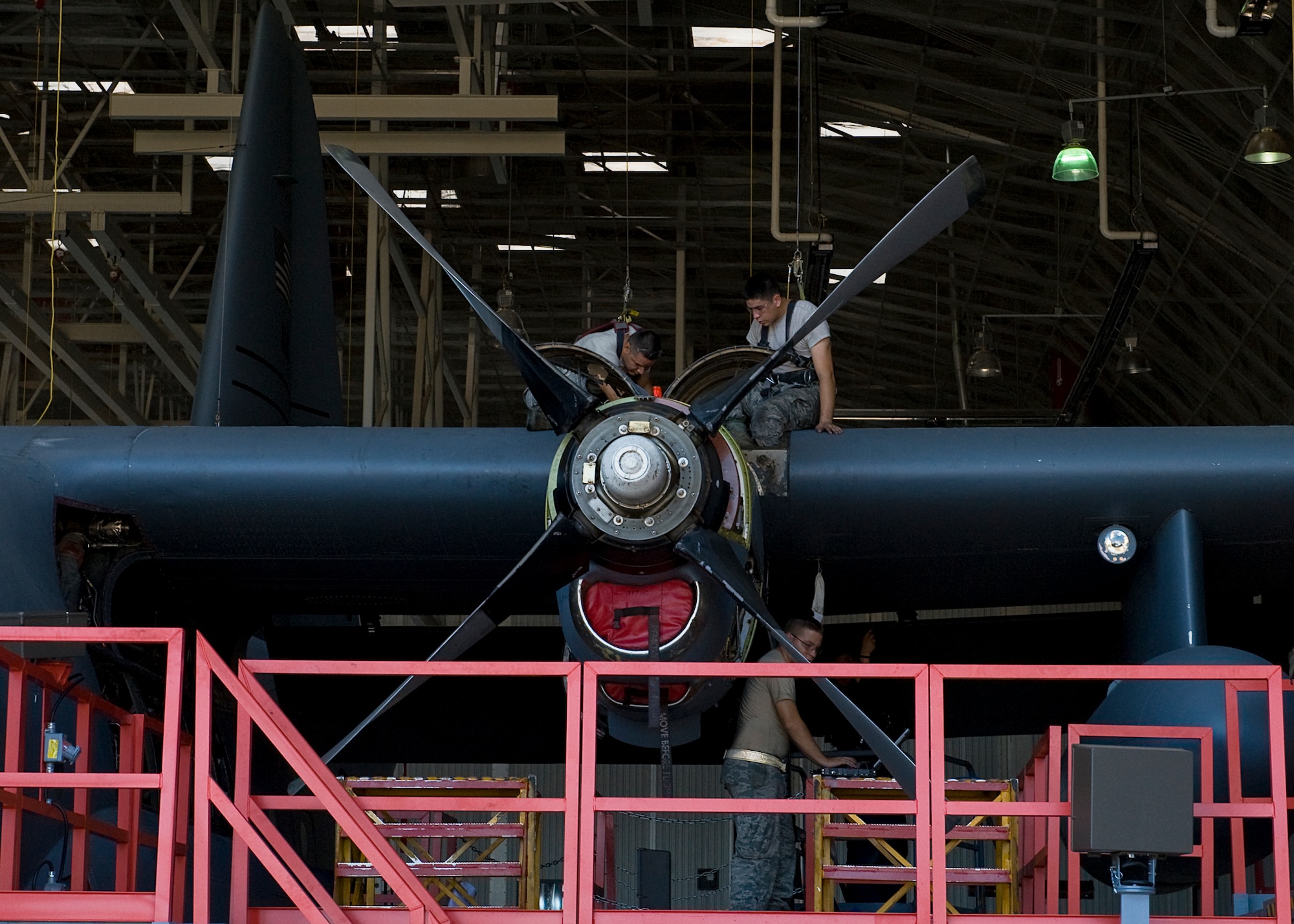 U.S. Air Force Staff Sgt. Immanuel Inadomi, left, and Airman 1st Class Justin Heaton, right, 317th Maintenance Squadron, hook up connections after changing the engine fuel, hydraulic lines and electrical connections July 20, 2012, during an isochronal inspection at Dyess Air Force Base, Texas. During the inspection, Airmen took the aircraft apart to check for cracks, damages and worn out parts. Once the aircraft is repaired, servicemembers put it back together and ensure everything works properly. The ISO inspection on aircraft 73-1598 marks the last time a C-130H will be inspected at Dyess.  The H-model era will come to an end later this year when the last C-130H will be withdrawn from service at Dyess. The fleet of 33 H-models will be replaced with 28 new C-130Js, making the 317th Airlift Group the largest J-model unit in the world. (U.S. Air Force photo by Airman 1st Class Damon Kasberg/Released)