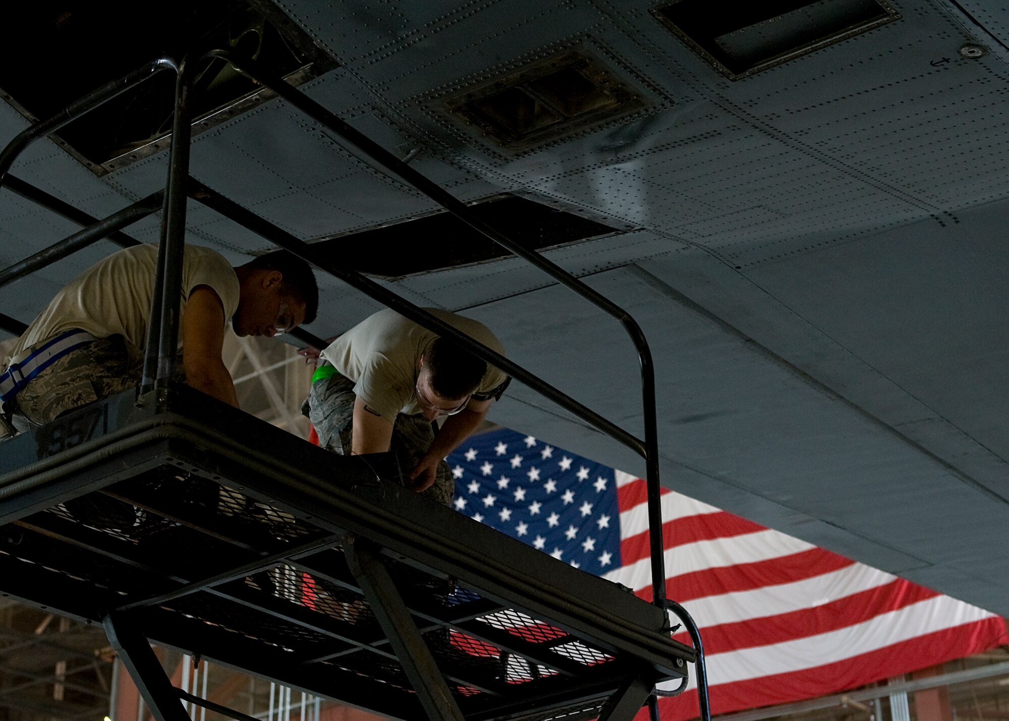 Senior Airman Joshua Obena, left, and Senior Airman John Ferguson, right, 317th Maintenance Squadron, reconnect the elevator after completing structural repairs on a C-130H July 20, 2012, during an isochronal inspection at Dyess Air Force Base, Texas. During the inspection, Airmen took the aircraft apart to check for cracks, damages and worn parts. Once the aircraft is repaired, servicemembers put it back together and ensure everything works properly. The ISO inspection on aircraft 73-1598 marks the last time a C-130H will be inspected at Dyess.  The H-model era will come to an end later this year when the last C-130H will be withdrawn from service at Dyess. The fleet of 33 H-models will be replaced with 28 new C-130Js, making the 317th Airlift Group the largest J-model unit in the world. (U.S. Air Force photo by Airman 1st Class Damon Kasberg/Released)