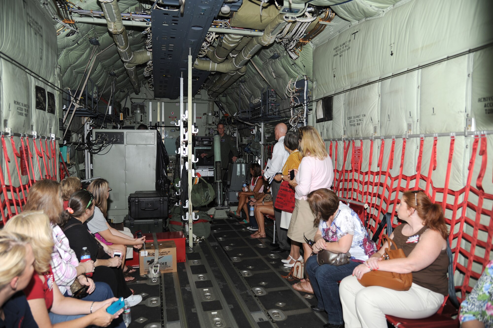Capt. Kyle Larson, 53rd Weather Reconnaissance Squadron, gives a tour of a C-130J aircraft during a tour for educators from local schools along the Gulf Coast July 26, 2012, at Keesler Air Force Base, Miss. They also toured the 335th Training Squadron weather school, received a briefing by the 403rd Wing on their job duties and ate lunch at the Sablich Center.  (U.S. Air Force photo by Kemberly Groue)