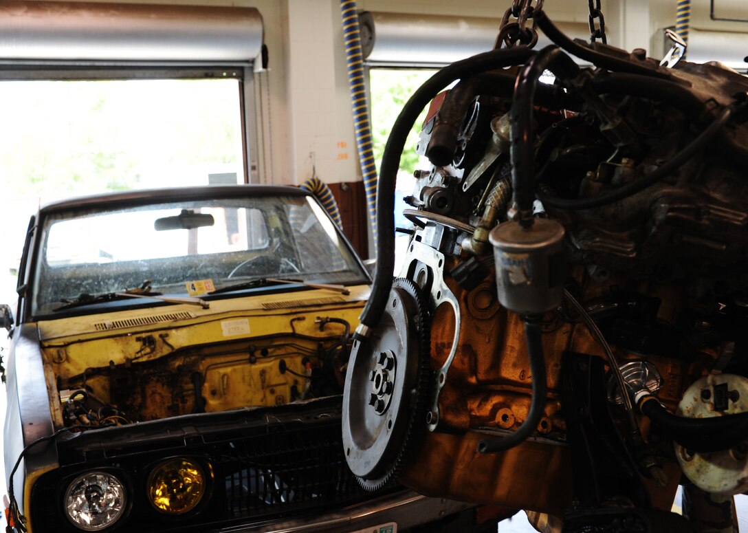 The auto hobby shop at Langley Air Force Base, Va., provided all of the tools necessary for U.S. Army Sgt. 1st Class Michael Daniel, a car enthusiast, to replace the engine in his 1976 Datsun 620 pickup truck July 12. Daniel plans to paint the truck and make other cosmetic changes as well. (U.S. Air Force photo by Airman 1st Class Austin Harvill/Released)