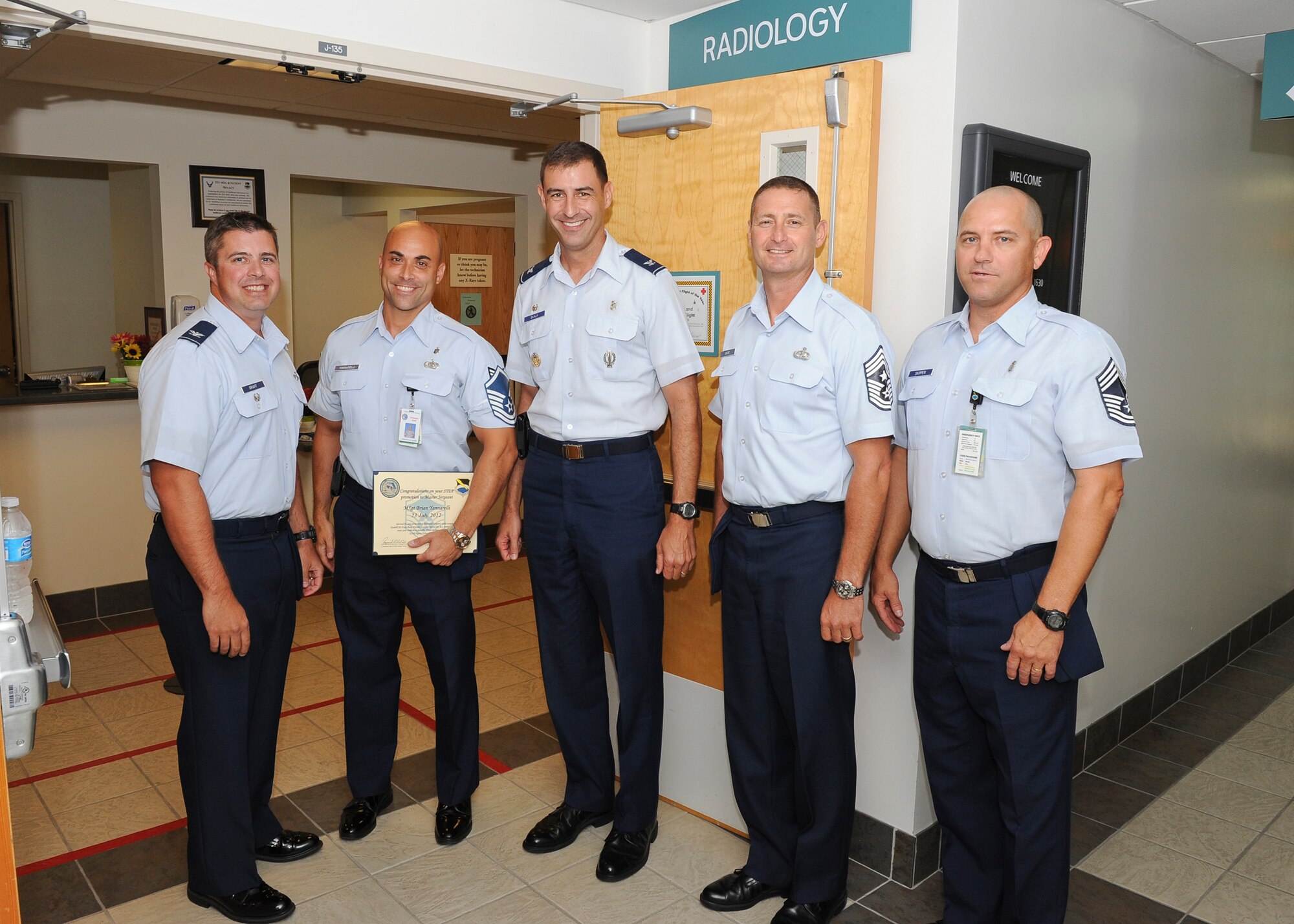 Master Sgt. Brian Yannarelli, 325th Medical Support Squadron (second from left), was awarded a Stripes for Exceptional Performers promotion to master sergeant. Col. David Graff, 325th Fighter Wing vice commander (left), and Col. Paul Skala, 325th Medical Group commander (right), present the rank along with Chief Master Sgt. Raymond DeVite, 325th FW command chief (second from right), and Chief Master Sgt. Stanley Skipper, 325th MDG superintendent. (U.S. Air Force photo by Chris Cokeing)