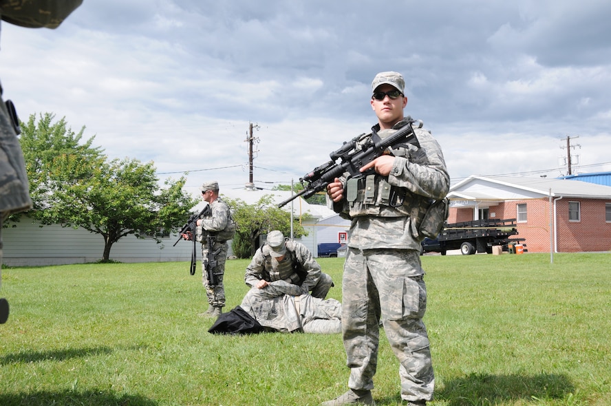 Airman 1st Class Blake Lentz, 193rd Special Operations Security Forces Squadron, stands guard during an enemy prisoner of war handling training scenario. The 193rd SOSFS had various types of training during their week-long annual training held at Fort Indiantown Gap, Annville, Pa. (Photo by: Air National Guard Photographer, TSgt Culeen Shaffer)