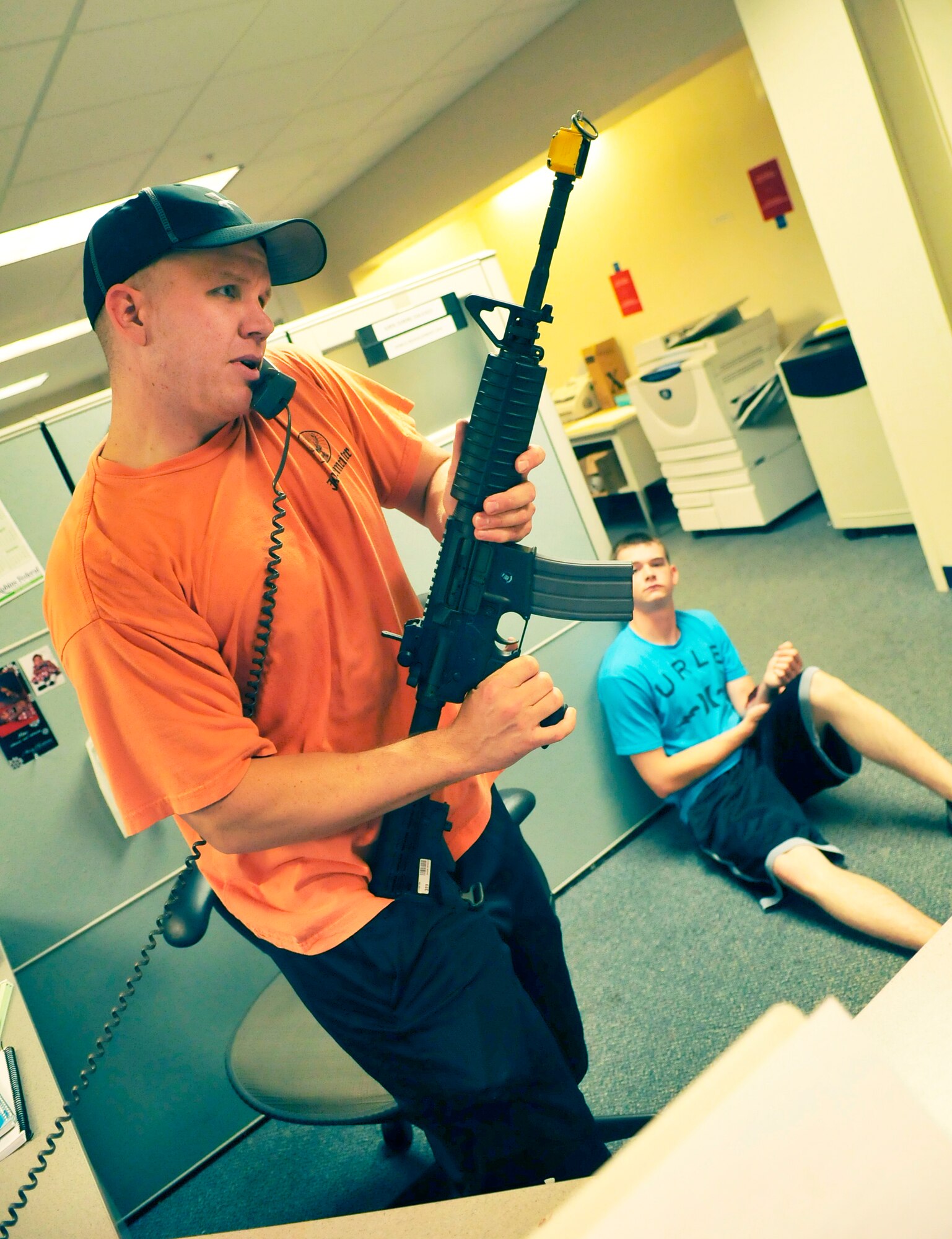A simulated shooter makes demands during an exercise Thursday. (U. S. Air Force photo/Sue Sapp)