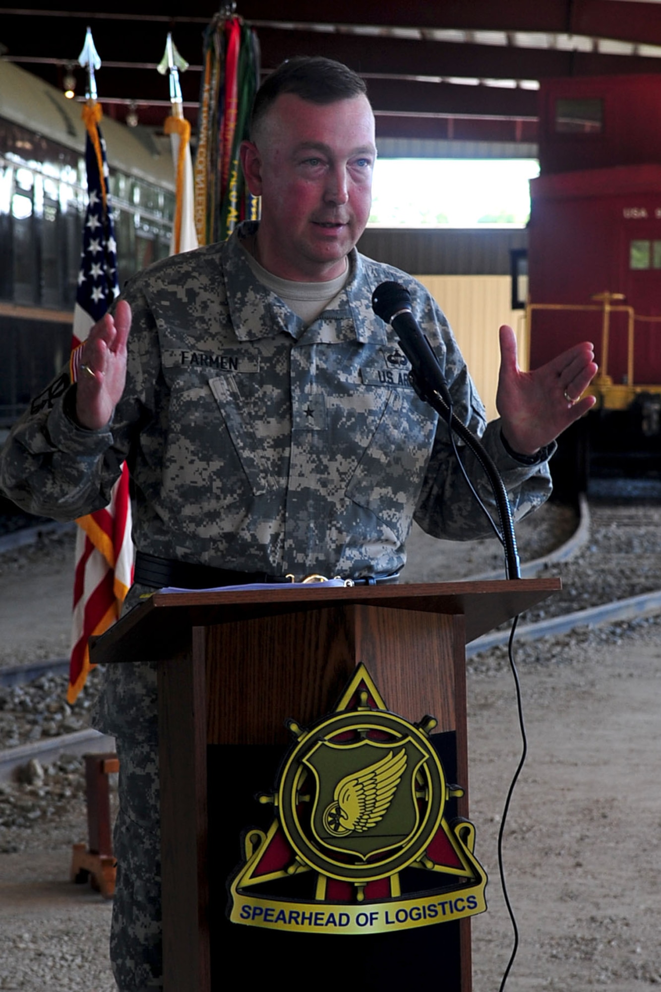 Brig. Gen. Stephen Farmen, U.S. Army chief of transportation, delivers his speech during the Transportation Corps’ 70th Anniversary Ceremony at Fort Eustis, Va., July 25, 2012. The Army Transportation Museum celebrated the anniversary by unveiling a new railyard pavilion, which encompasses 45,000 square feet of permanent shelter for the museum's artifacts. (U.S. Air Force photo by Staff Sgt. Ashley Hawkins/Released)