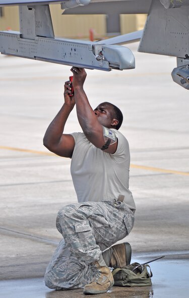 Senior Airman Bryan Jay, 482nd Aircraft Maintenance Squadron, prepares an F-16 to be loaded with an AIM-9X missile, during the 482nd Aircraft Maintenance Squadron’s quarterly Load Crew Competition at Homestead Air Reserve Base, July 15. The AIM-9X is a supersonic, air-to-air guided missile.
