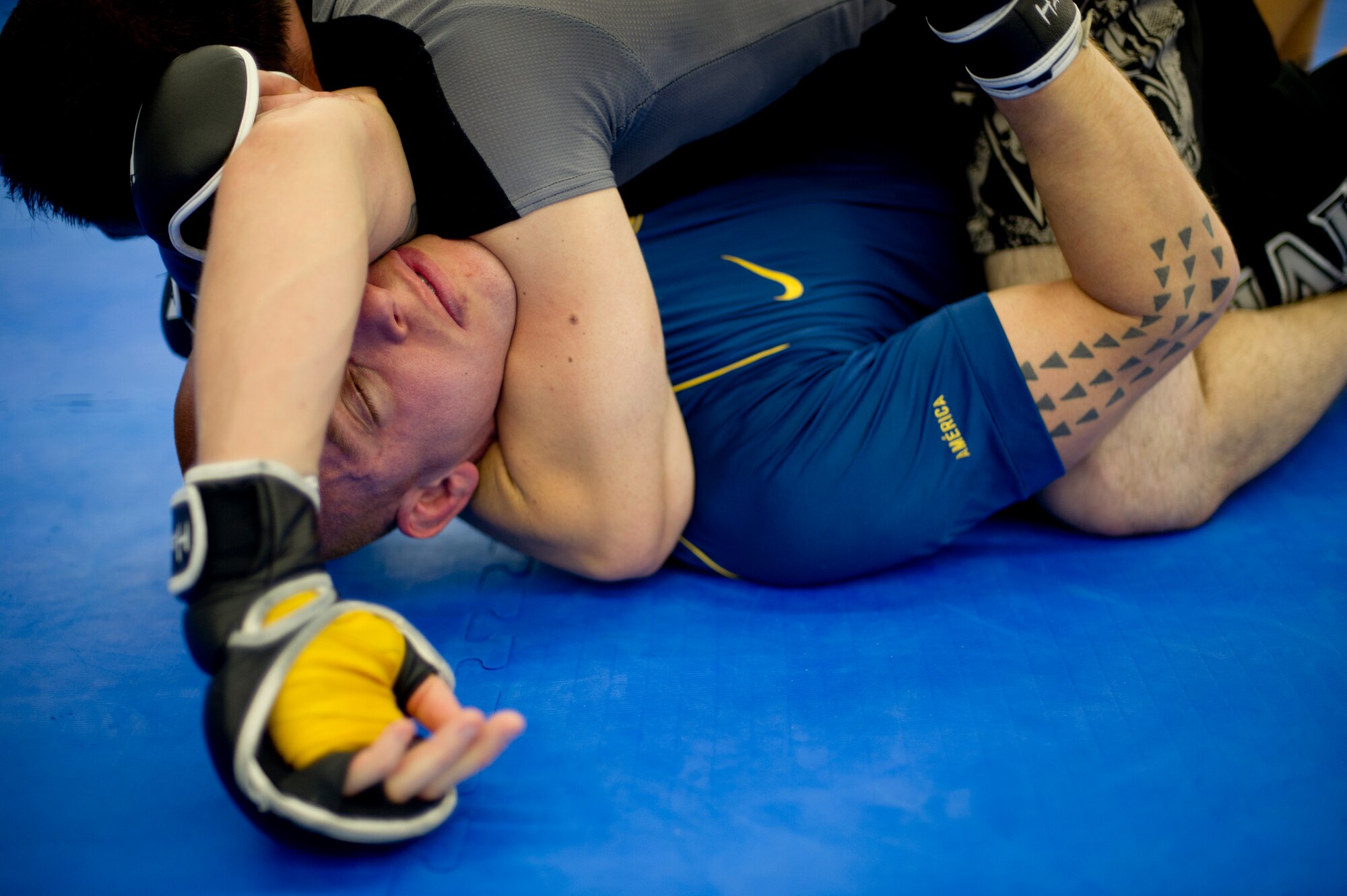 Tech. Sgt. Stephen Pina, 22nd Civil Engineer Squadron firefighter, spars with his training partner at a local mixed martial arts gym June 7, 2012, Wichita, Kan. Pina has developed his Jiu Jitsu skills through training and helps to inspire other Airmen to maintain a strong fitness level. (U.S. Air Force photo/ Airman 1st Class Armando A. Schwier-Morales) 