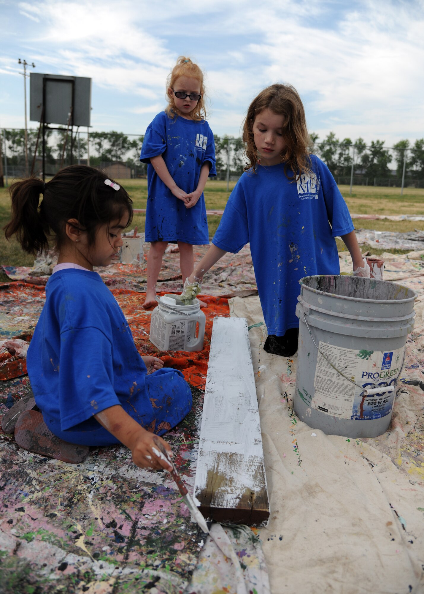 From left, Marissa Saocedo, Avianna Lupton and Katelynn Fennell work on an art project at the Exceptional Family Member Program Art Camp, July 24, 2012, on Grand Forks Air Force Base, N.D.  About two dozen children participated in the camp and the completed project will be permanently mounted by the base pond.  (U.S. Air Force photo/Airman 1st Class Ashley N. Taylor) 