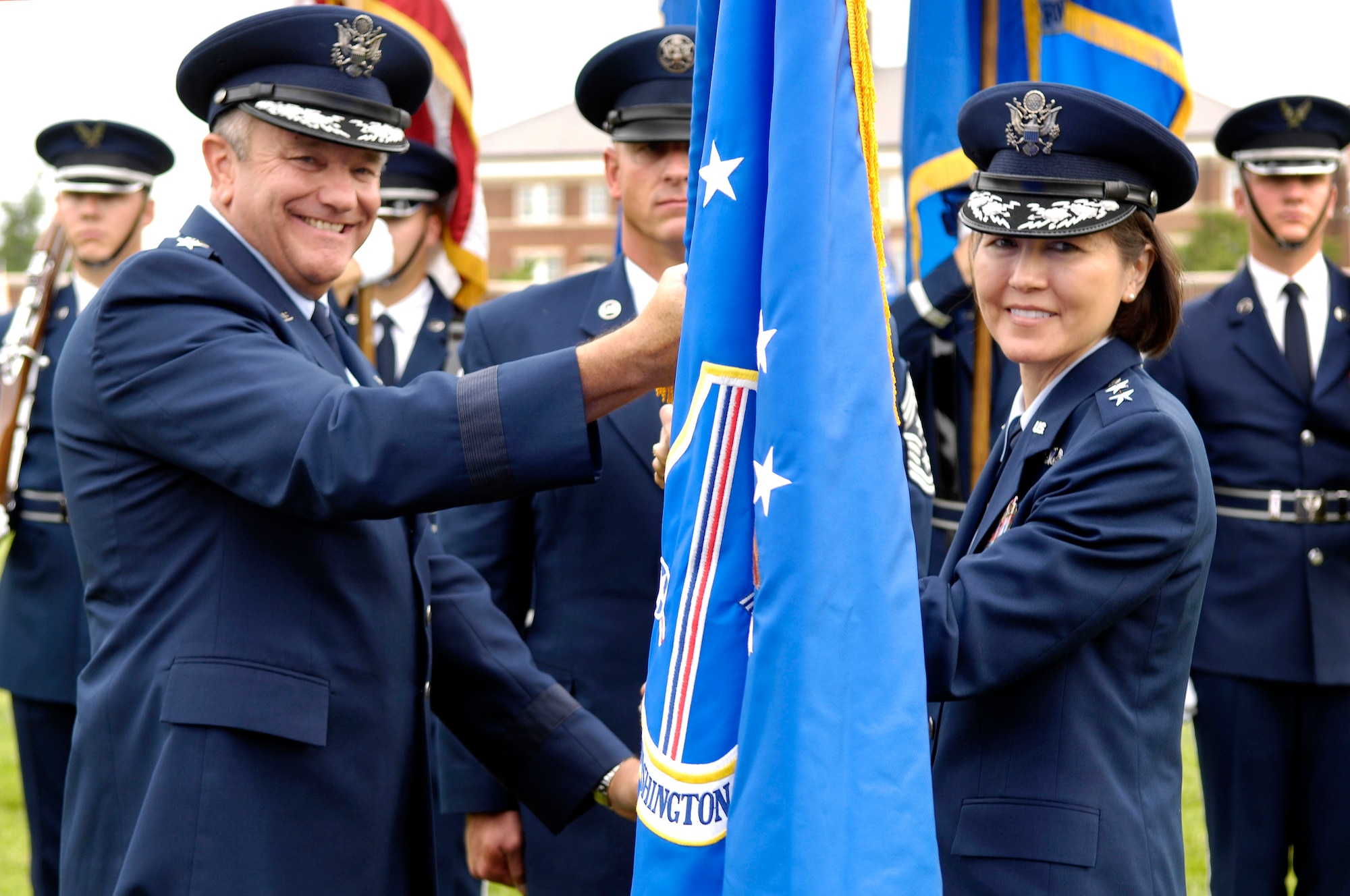 Maj. Gen. Sharon Dunbar accepts command of the Air Force District of Washington from Air Force Vice Chief of Staff Gen. Philip Breedlove during a change of command ceremony on the U.S. Air Force Ceremonial Lawn July 26 at Joint Base Anacostia-Bolling, Washington, D.C. (U.S. Air Force photo by Senior Airman Steele C. G. Britton)
