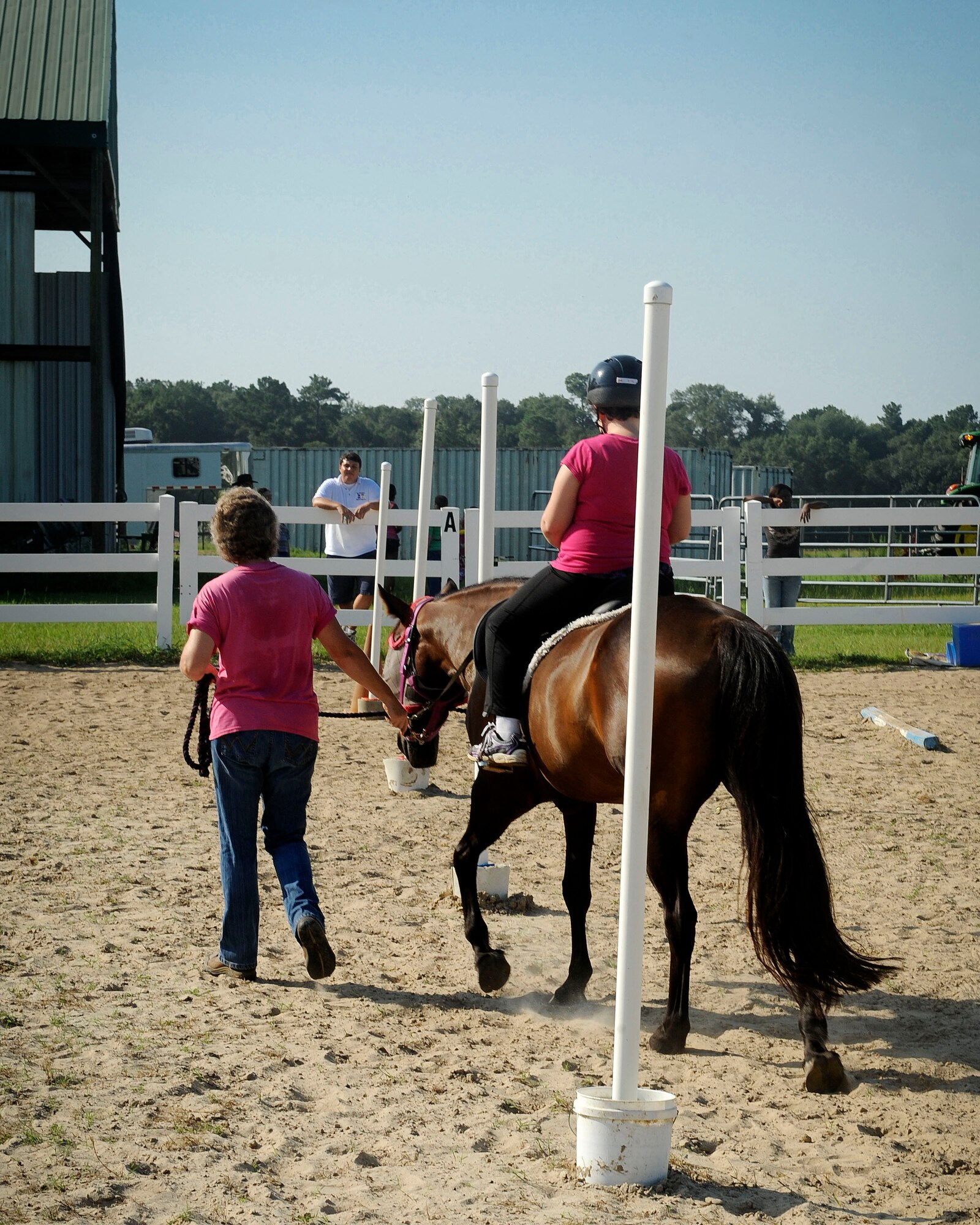 Hannah  Featherston rides a horse with the assistance of Leslie Jacobs, owner of Jacobs’ Ladder Therapeutic Riding Center, Hahira, Ga., July 25, 2012. Jacobs started the program in 1999 with four riders a week. The center first partnered with Moody Air Force Base, Ga., in April 2011 and has since continued to provide activities to families within the Exceptional Family Members Program. (U.S. Air Force photo by Staff Sgt. Ciara Wymbs/Released)