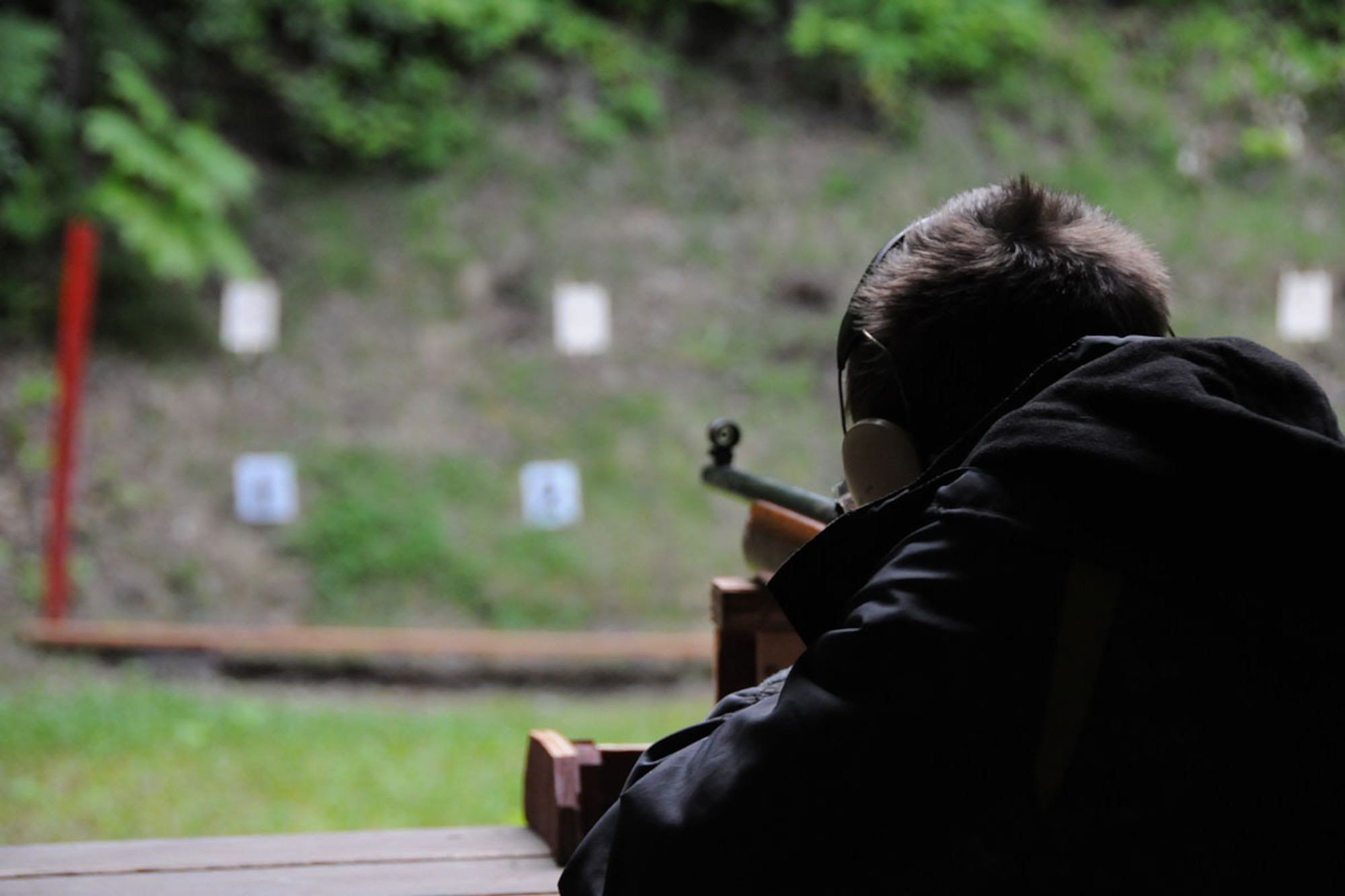 Grady Desaussure, a scout of JBER’s Boy Scout Troop 190, aims a .22 rifl e at a target at the Camp Gorsuch Rifl e Range during the second week of camp. One of the requirements for rifl e merit badge is for Scouts to place fi ve shots that will fi t under a quarter from 50 feet. (U.S. Air Force photo/Senior Airman Ross Whitley)