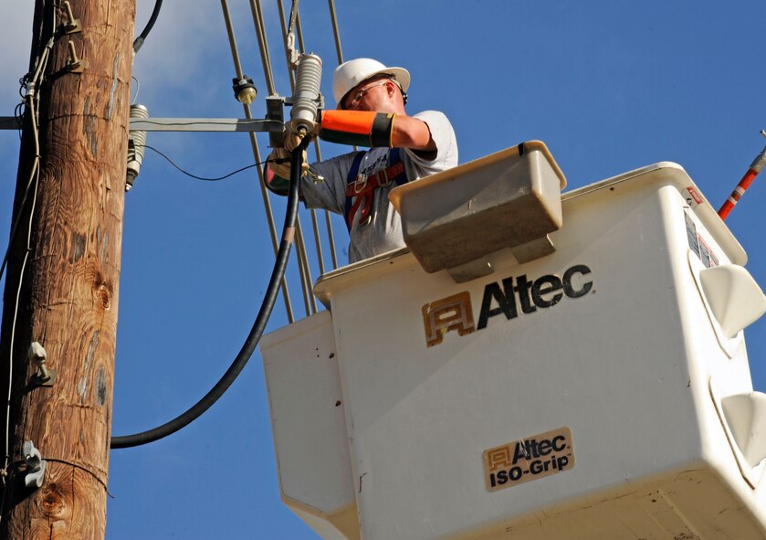 Jay Ryan, 2nd Civil Engineer Squadron electric shop, prepares to replace blown fuses on Barksdale Air Force Base, La., July 26. The blown fuses caused a power outage in multiple buildings along Lindbergh Ave. (U.S. Air Force photo/Airman 1st Class Andrew Moua)(RELEASED)