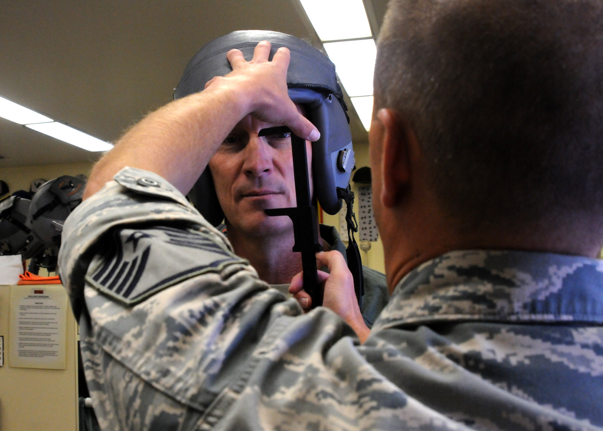 Maj. Gen. Timothy Zadalis, Director of Intelligence Operations and Nuclear Integration Headquarters at Air Education and Training Command, begins preparations for his familiarization flight in an F-15 Eagle with the help of Master Sgt. Kenneth Shearer, 114th Fighter Squadron, at Kingsley Field, Ore., July 24, 2012. Kingsley Field was just moved under the command of Zadalis earlier this year. (Air National Guard photo by Airman 1st Class Penny Hamilton/Released)
