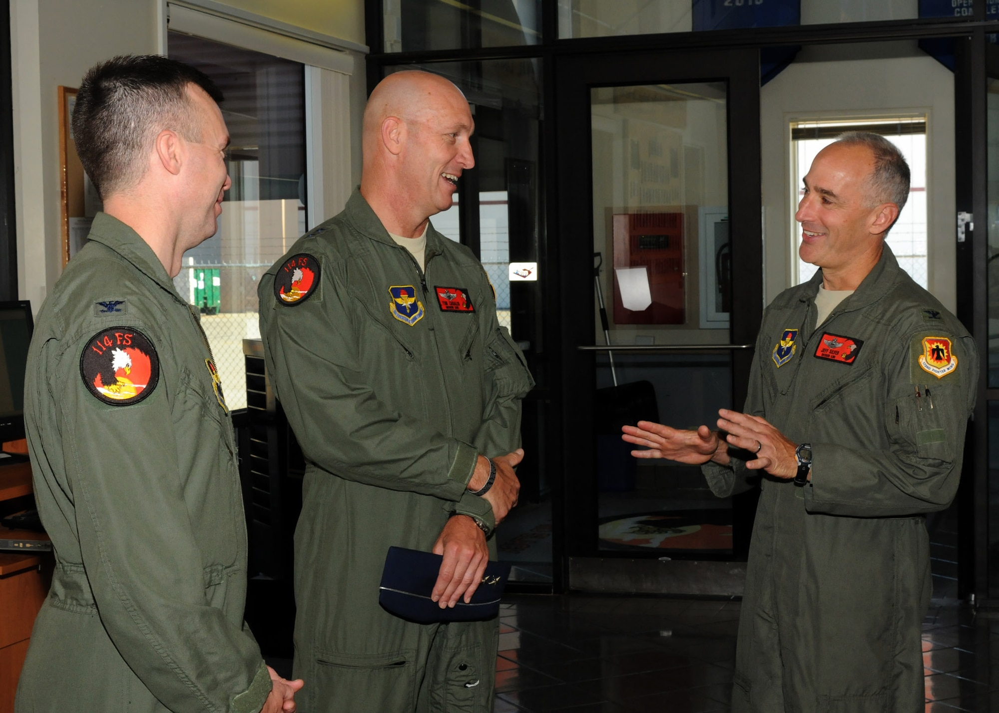 Maj. Gen. Timothy Zadalis, Director of Intelligence Operations and Nuclear Integration Headquarters at Air Education and Training Command, visits members of the 173rd Fighter Wing and 114th Fighter Squadron before beginning preparations for his incentive flight in an F-15 Eagle at Kingsley Field, Ore., July 24, 2012. Kingsley Field was just moved under the command of Zadalis earlier this year. (Air National Guard photo by Airman 1st Class Penny Hamilton/Released)