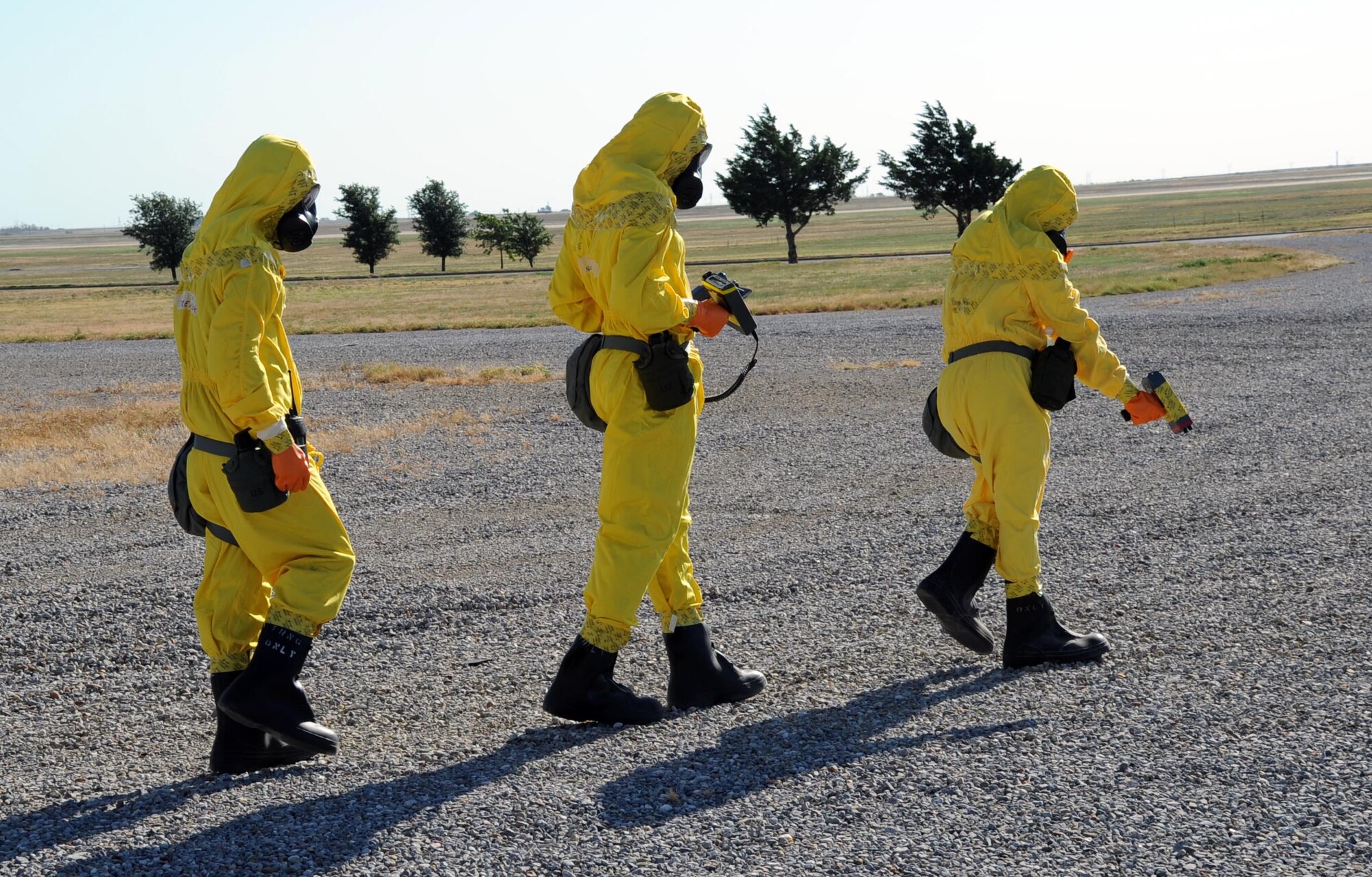 Airmen from the 301st Civil Engineering Squadron as well as Sheppard Emergency Management Team walk into a radiation “Hot Zone” during a training exercise July 25.  The 301st CES is based out of the Fort Worth Joint Reserve Base in Fort Worth, Texas.