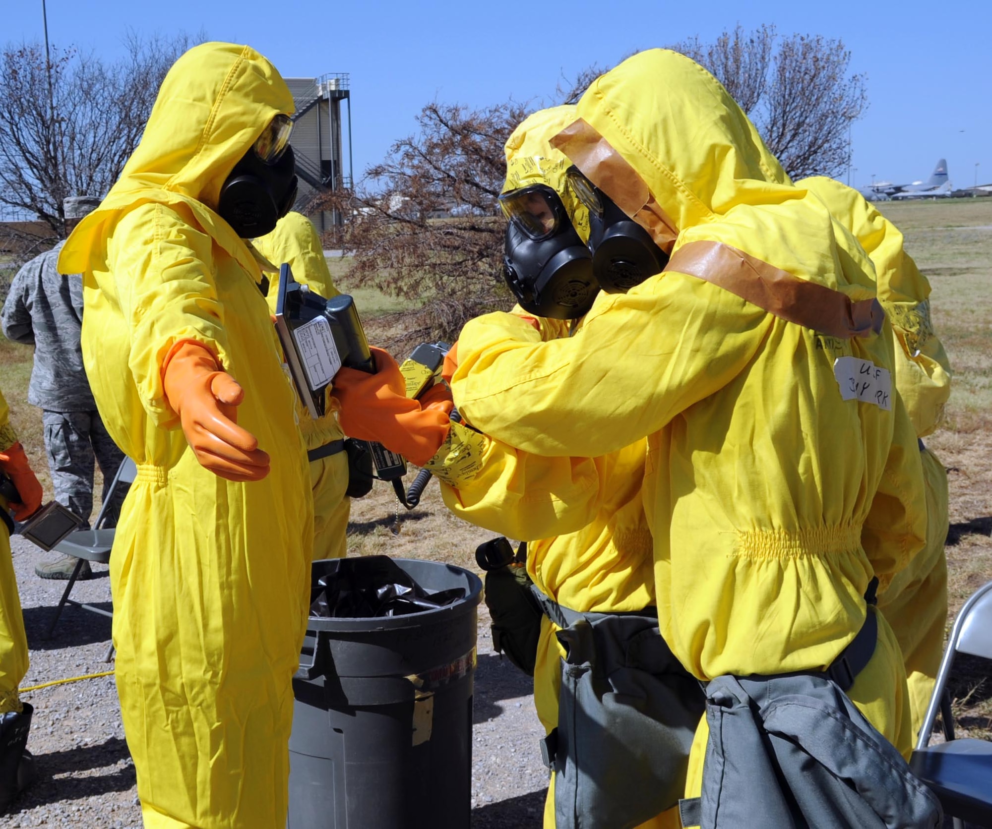 Jeremy Kirk instructs Airmen from the 301st Civil Engineering Squadron as well as Sheppard Emergency Management Team on proper decontamination procedures during a training exercise July 25.  The 301st CES is based out of the Fort Worth Joint Reserve Base in Fort Worth, Texas.