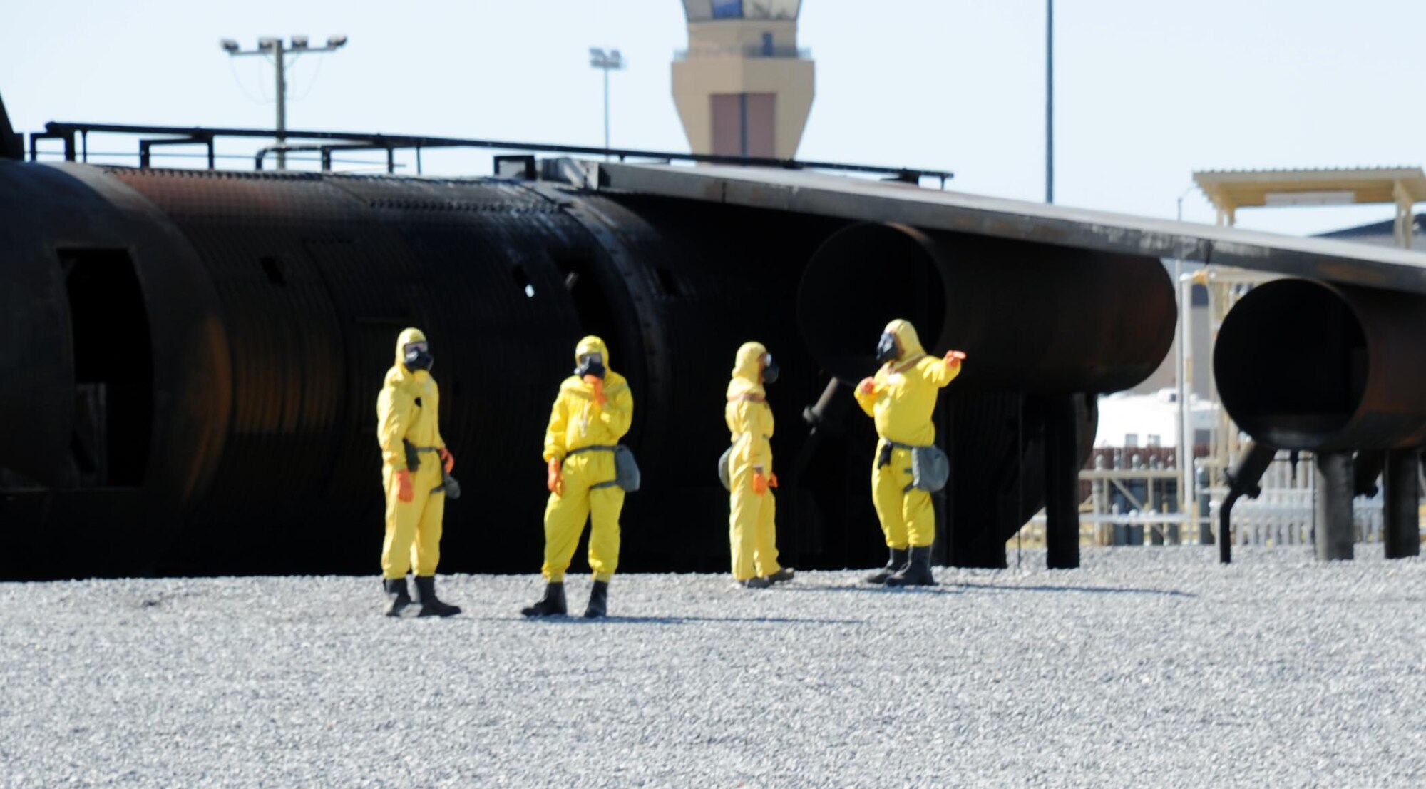 Airmen from the 301st Civil Engineering Squadron as well as Sheppard Emergency Management Team walk around a radiation “Hot Zone” during a training exercise July 25.  The 301st CES is based out of the Fort Worth Joint Reserve Base in Fort Worth, Texas.