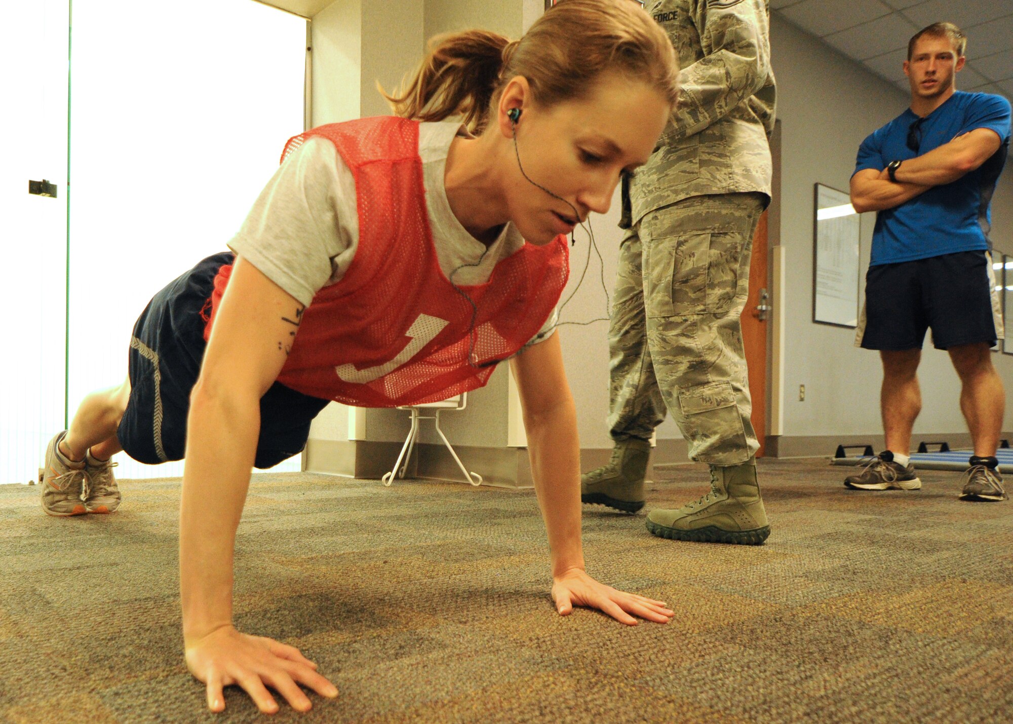 Tech. Sgt. Jessica Fruth, 315th Airlift Wing client systems technician, performs pushups during her annual fitness test July 16, 2012, at Joint Base Charleston, S.C. Fruth volunteers as a yoga and CrossFit instructor at the JBC Fitness & Sports Center, and she is dedicated to living a lifestyle of health and wellness. Furth’s lifestyle allows her to stay mentally, socially and physically strong which ensures she is always fit to fight. (U.S. Air Force photo/Staff. Sgt. Shane Ellis)
