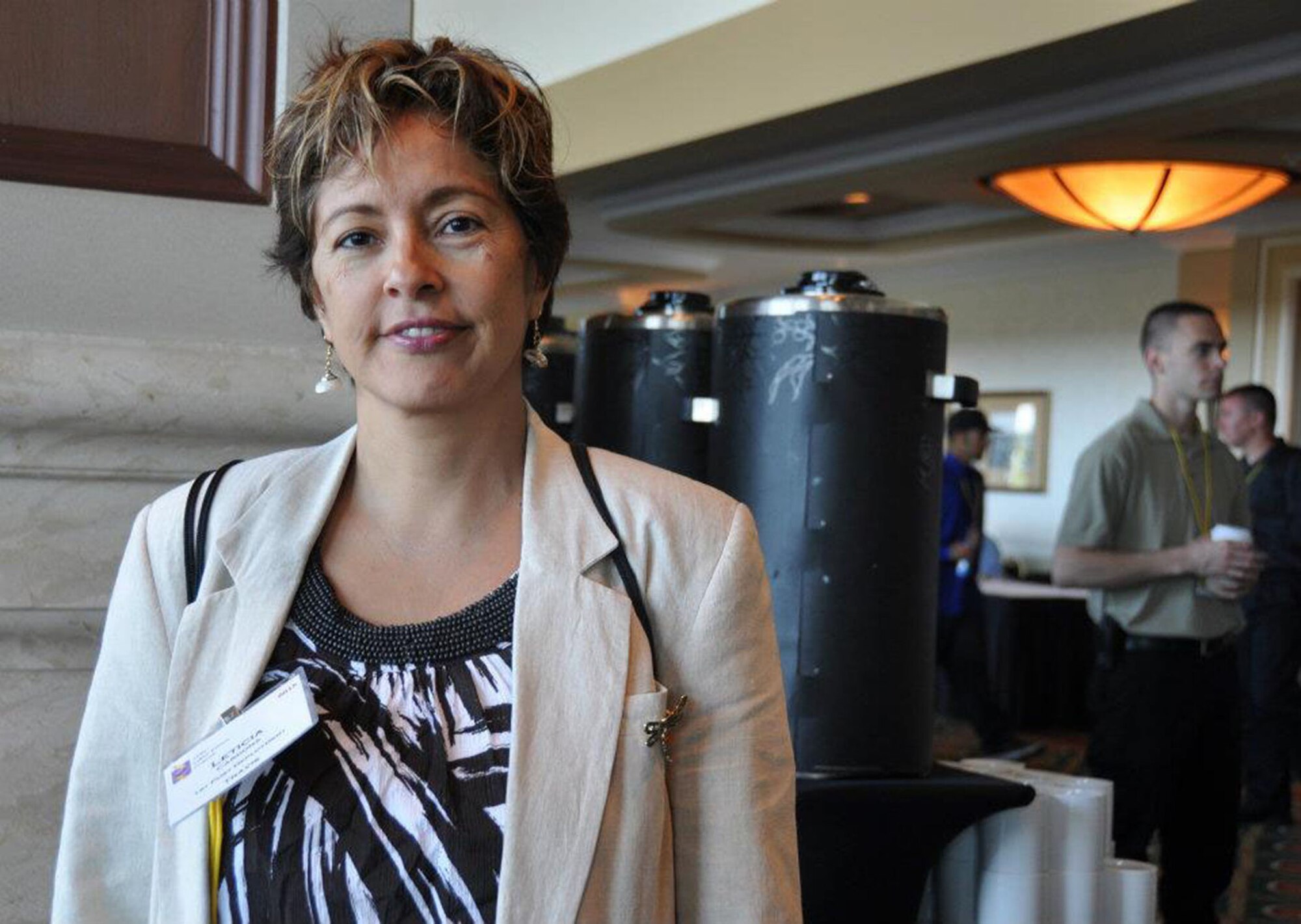 TRAVIS AIR FORCE BASE, Calif. -- Capt. Liticia Cardona, flight nurse with the 349th Aeromedical Evacuation Squadron, takes a snack break during the first day of the Yellow Ribbon conference held in San Diego during the weekend of July 20, 2012. Cardona brought her mother and niece to the event so that they could get a better sense of what goes on in deployments and what services are available to them as family members, she said. (U.S. AIR FORCE PHOTO/ Senior Airman Amelia Leonard)