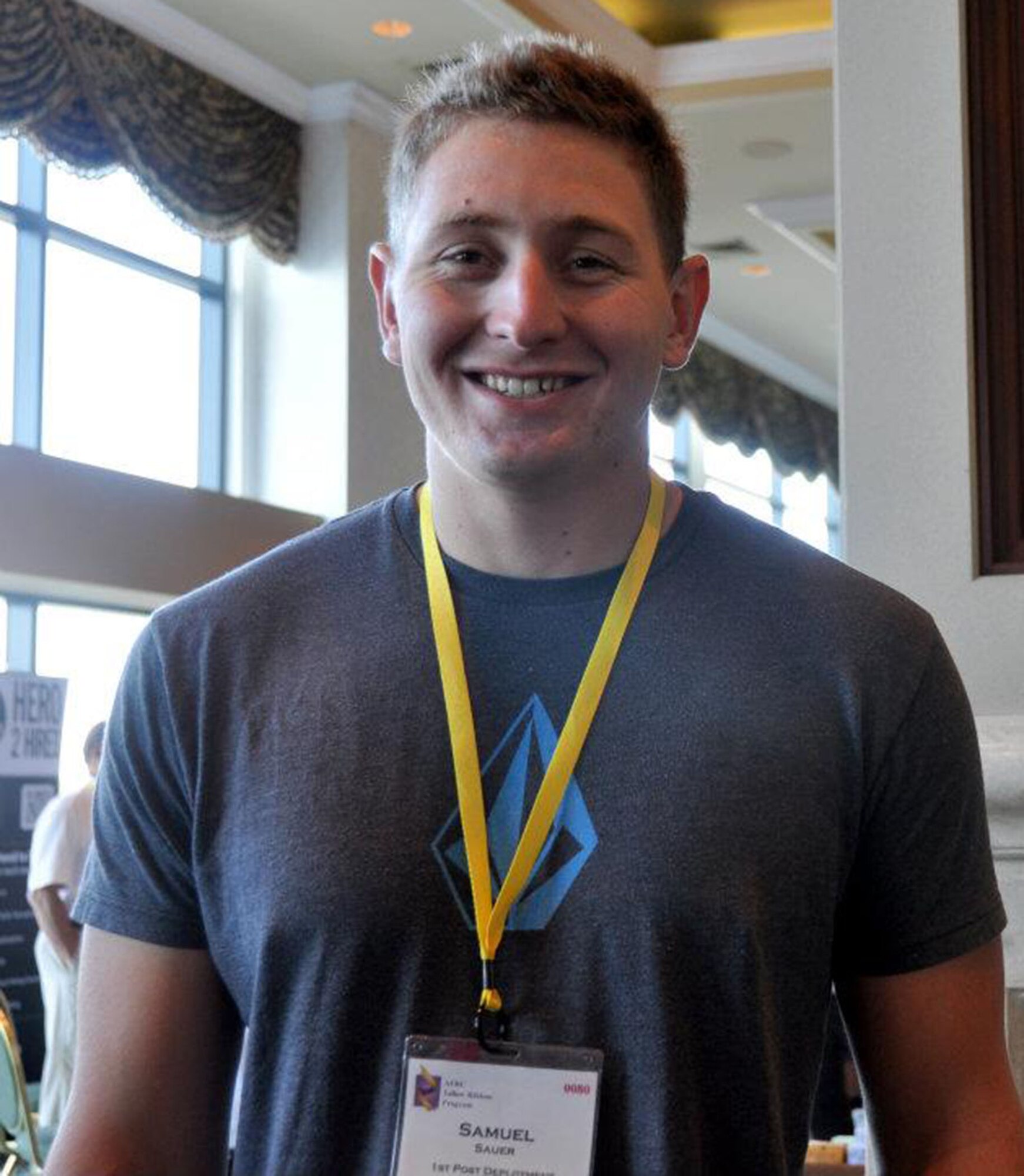 TRAVIS AIR FORCE BASE, Calif. -- Senior Airman Samuel Sauer, 55th Arial Port Squadron, flashes a smile for the camera while taking a break from a classroom session during a Yellow Ribbon event held in San Diego the weekend of July 20, 2012. Sauer recently returned from a deployment to Bagram, and came to the event hoping to gain information about his G.I. Bill benefits, and gather information for some of his buddies in his unit, he said. (U.S. AIR FORCE PHOTO/ Senior Airman Amelia Leonard)