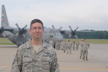 YOUNGSTOWN AIR RESERVE STATION, Ohio -- U.S. Air Force Reserve Master Sgt. Thomas Mason, historian with the 910th Airlift Wing here, stands in front of the flightline here, July 8, 2012, during a wing photo assembly. Mason is a 25-year veteran of the Air Force and recently was awarded the 2011 Air Force Reserve Command Wing History Award for his superior documentation of the 2009 YARS mission. U.S. Air Force photo by Tech. Sgt. Matt Matulka
