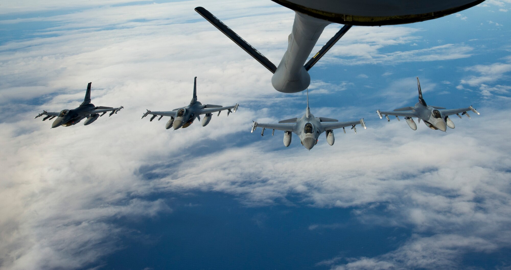 F-16 Fighting Falcons with the 144th Fighter Wing, California Air National Guard fly in formation after receiving fuel from a KC-135 Stratotanker with the 465th Air Refueling Squadron, Tinker Air Force Base, Okla. during Rim of the Pacific exercise, July 24, 2012. Twenty-two nations, more than 40 ships and submarines, more than 200 aircraft and 25,000 personnel are in RIMPAC exercise from June 29 to Aug. 3, in and around the Hawaiian Islands. The world's largest international maritime exercise, RIMPAC provides a unique training opportunity that helps participants foster and sustain the cooperative relationships that are critical to ensuring the safety of sea lanes and security on the world's oceans. RIMPAC 2012 is the 23rd exercise in the series that began in 1971.