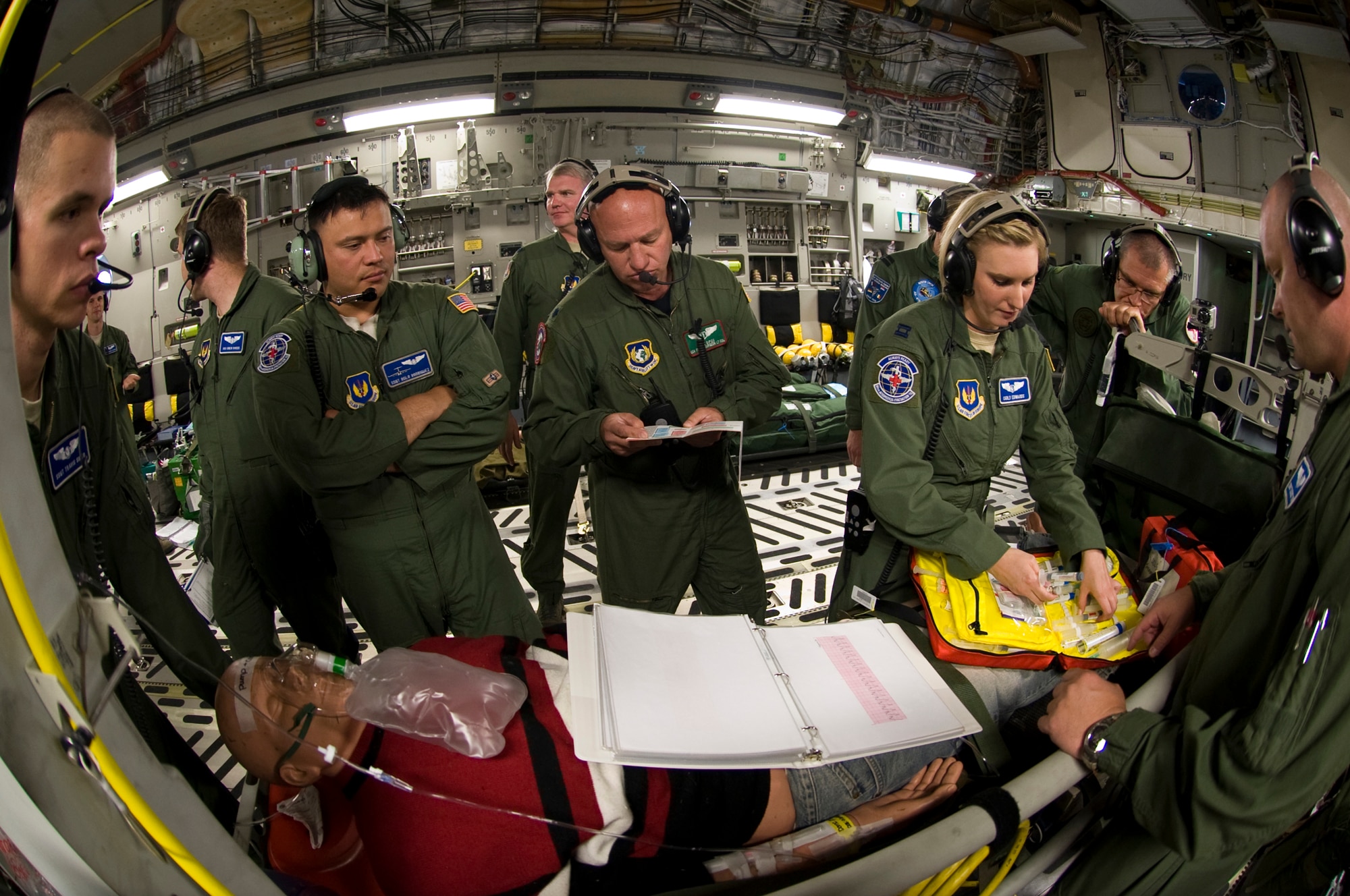 U.S. Air Force members from the 86th Aeromedical Evacuation Squadron, Ramstein Air Base, Germany conduct medical training scenarios aboard C-17 Globemaster III aircraft from the Heavy Airlift Wing (HAW) during a training flight to Tbilisi, Georgia, July 25, 2012.  The mission marked the first aeromedical training mission executed by the HAW, a multinational C-17 Wing comprised of members from 12 nations.  (U.S. Air Force photo/MSgt Wayne Clark, AFNE Regional News Bureau) (Released)