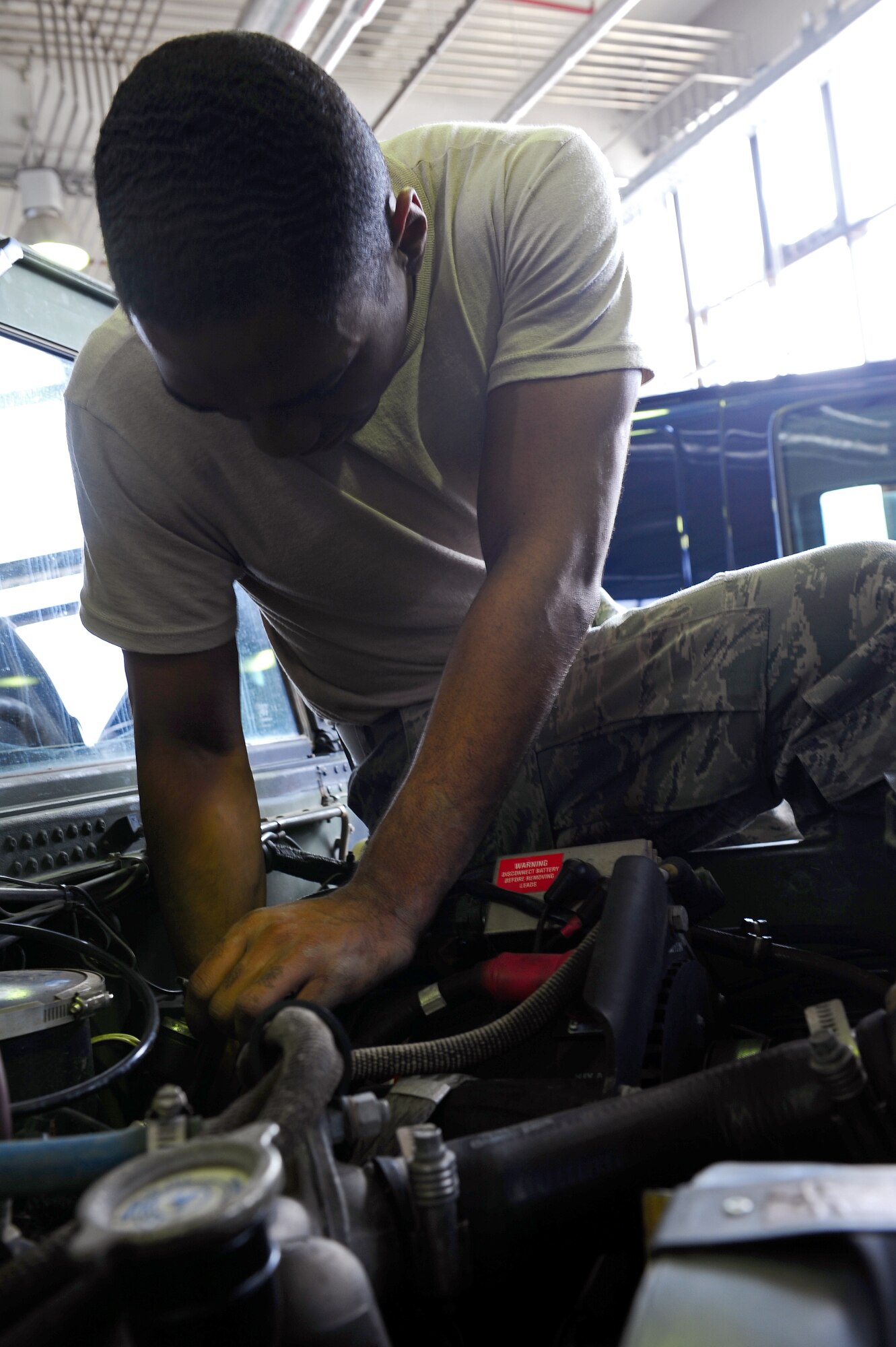 Airman 1st Class Javon Lucus-Chamberland, 86th Vehicle Readiness Squadron vehicular maintenance mechanic, trouble shoots a faulty speedometer on a humvee at the 86th VRS general purpose light shop on Ramstein Air Base, Germany, July 12, 2012. The 43 members of GP Light work hard year-round to provide premier full-service vehicle operations and management support to members of Team Ramstein and associate units across Europe and Africa. (U.S. Air Force photo/Airman 1st Class Holly Cook)