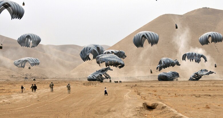 BALA MURGHAB, Afghanistan – Service members retrieve cargo dropped from a U.S. Air Force C-17 Globemaster III from Charleston Air Force Base, S.C., near Forward Operating Base Todd, Badghis Province, Afghanistan, Jan. 6, 2011. U.S. Soldiers from Fort Carson, Colo., Italian soldiers from the Alpini Regiment in Udine, and other various U.S. and Italian Marines, Soldiers, Sailors and Airmen all benefit from the airdrops. The FOB and more than a dozen nearby combat outposts rely on U.S. and Italian Air Force airdrops for all their supplies. This photo was originally released Jan. 8, 2011. (U.S. Air Force photo/Master Sgt. Kevin Wallace)