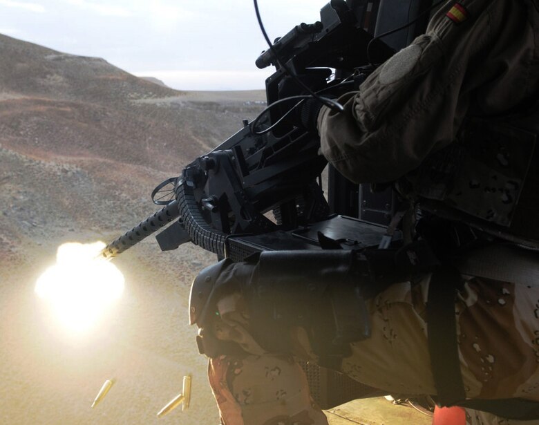 BALA MURGHAB, Afghanistan – A Spanish soldier engages insurgents from an AS532 Super Puma, which flew a four-ship combat patrol over the hills of Badghis Province in northwestern Afghanistan Dec. 19, 2010. The Spanish patrol departed from Camp Arena, Herat, and was part of a multi-national effort supporting the International Security Assistance Force. This photo was originally released Nov. 1, 2010. (U.S. Air Force photo/Master Sgt. Kevin Wallace)