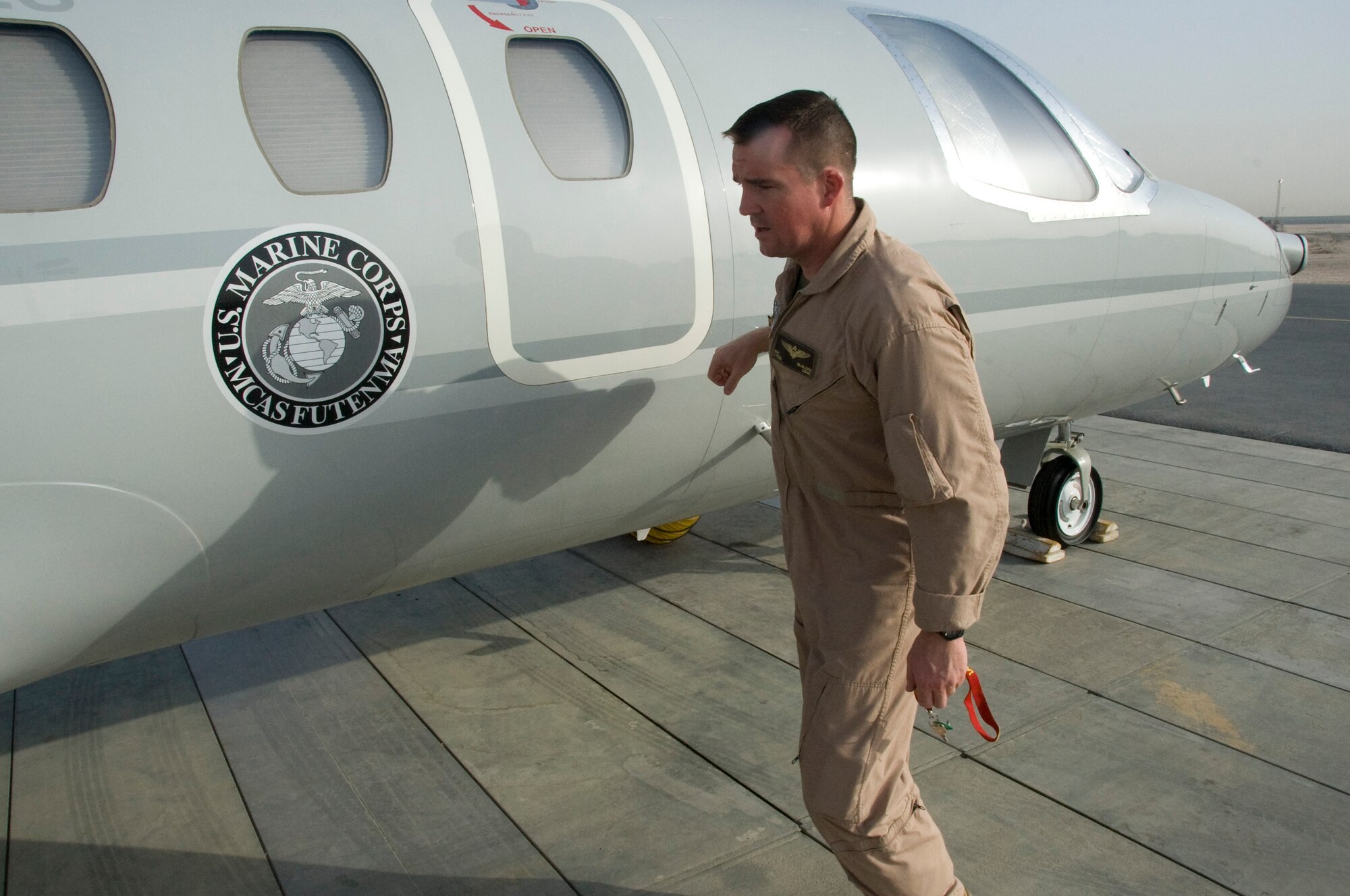 Marine Corps Lt. Col. Brian Blalock, VMR Detachment aircraft commander, conducts a pre-flight check before flying to Afghanistan for a mission in Southwest Asia July 26, 2012. The Fixed Wing Marine Transport Squadron Detachment’s mission is to transport military leadership, distinguished visitors and anyone deemed mission critical around the area of responsibility. (U.S. Air Force photo/Senior Airman Bryan Swink)