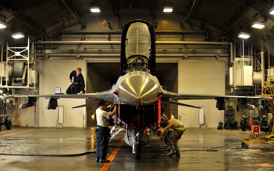 U.S. Air Force Airmen from the 35th Maintenance Group inspect an F-16 Fighting Falcon after installing a new engine at Misawa Air Base, Japan, July 25, 2012. Stringent checks were made on all 35th Fighter Wing aircraft to ensure their safety after a pilot ejected from his F-16 in the Pacific Ocean on July 22. The 35 FW subsequently grounded its aircraft for additional inspections coupled with stringent routine checks before resuming its flying mission July 26. (U.S. Air Force photo by Staff Sgt. Nathan Lipscomb/Released) 