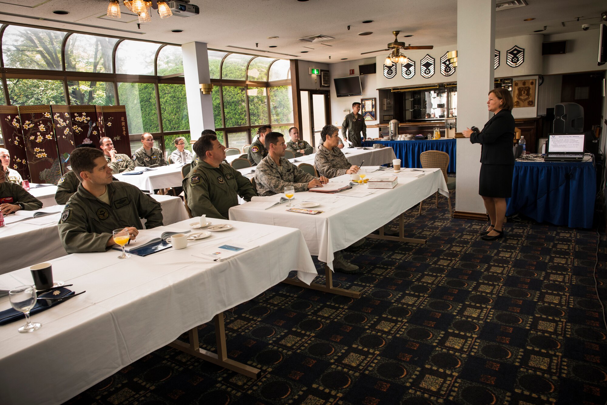 YOKOTA AIR BASE, Japan -- Kathy Malowney, Safety Board President Course instructor, talks to a class of field-grade officers and colonels about interview techniques in the Yokota Enlisted Club Top Three Lounge at Yokota Air Base, Japan, July 26, 2012. Yokota hosted the class, normally held at Kirtland Air Force Base, N.M., saving the Air Force approximately $88,000 in transportation and lodging costs. (U.S. Air Force photo by Tech. Sgt. Samuel Morse)