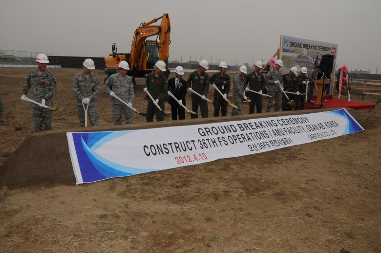 The distinguished guests broke ground on the new Operations and Aircraft Maintenance Unit Facility April 10 at Osan Air Base.