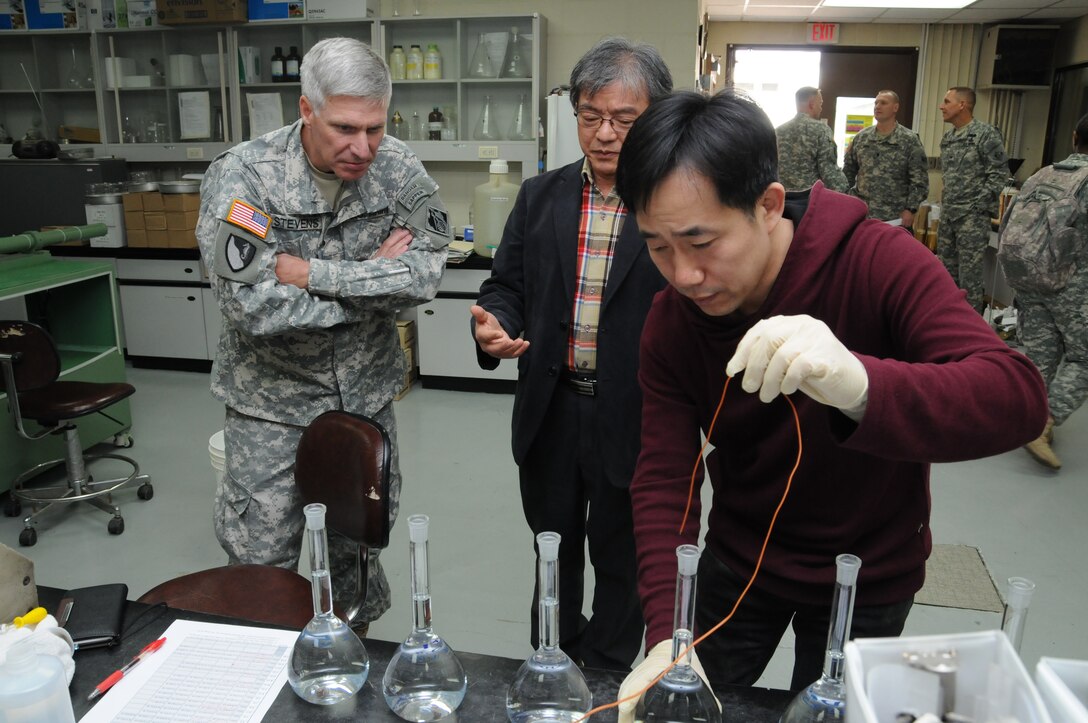 Brig. Gen. Richard Stevens, U.S. Army Corps of Engineers, Pacific Ocean Division Commander, watches soil testing at Far East District. 