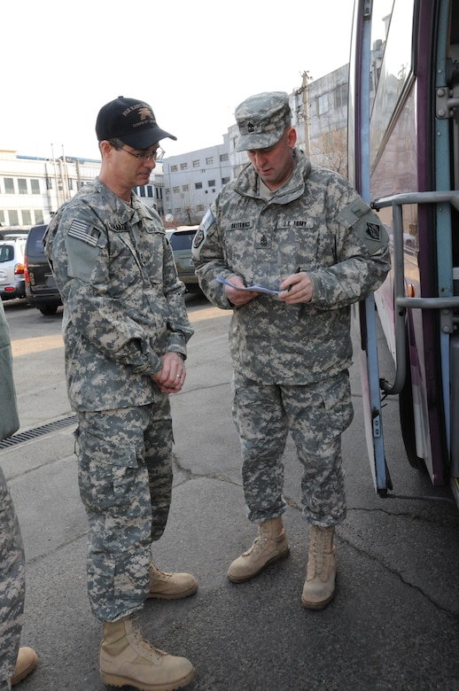 Kevin Shanahan, FED Business Process Manager, checks in with Sgt. Maj. David Breitbach, Security Plans and Operations, before departing to Daegu in support of Key Resolve 2012. (Photo by Patrick Bray)