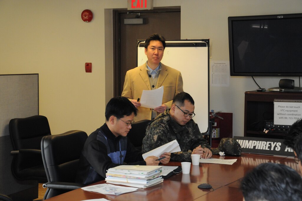 Ha Chae-un, Engineer for FED Humphreys Area Office, gave engineers from the Korean Ministry of National Defense an overview of U.S. Army Garrison Humphreys expansion and the workings of the area office during the MND Exchange Program Feb. 15.  (Photo by Patrick Bray)
