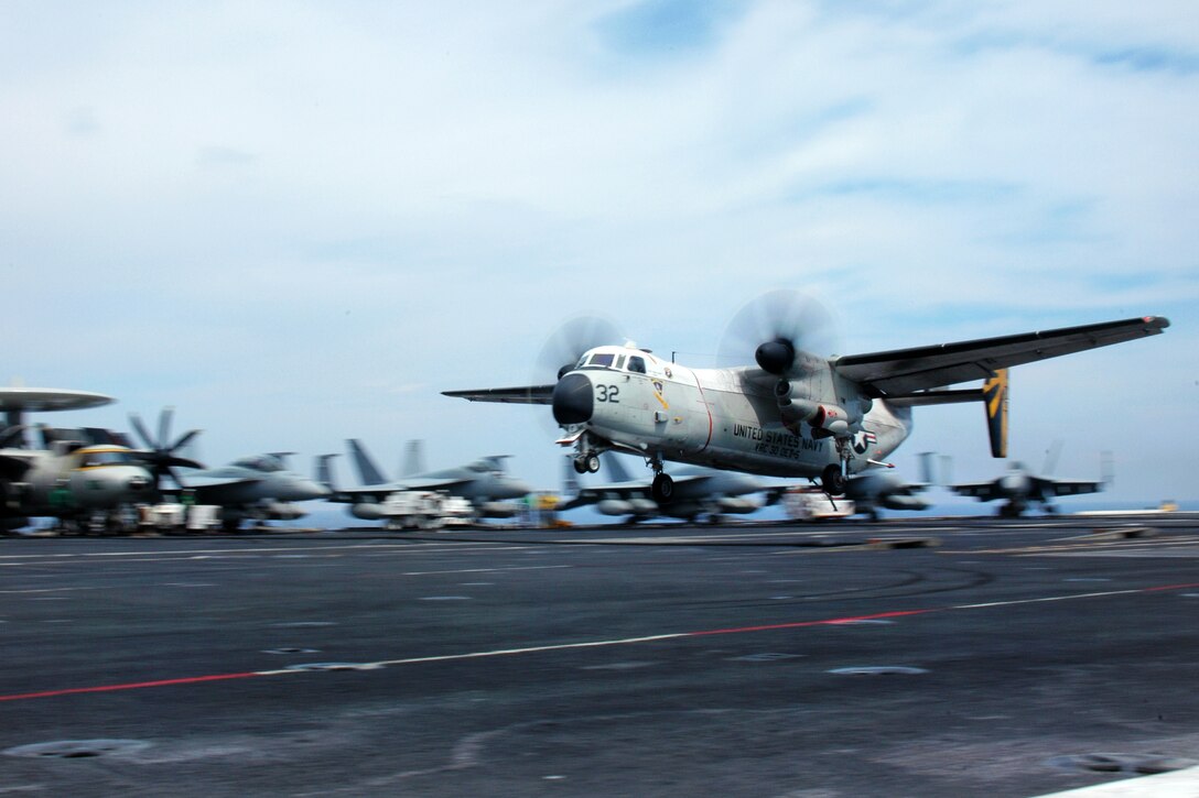 A C-2A Greyhound aircraft approaches the flight deck of the USS George Washington under way in the Philippine Sea, July 24, 2012. The aircraft is assigned to the Providers of Fleet Logistic Support Squadron 30, Detachment 5.