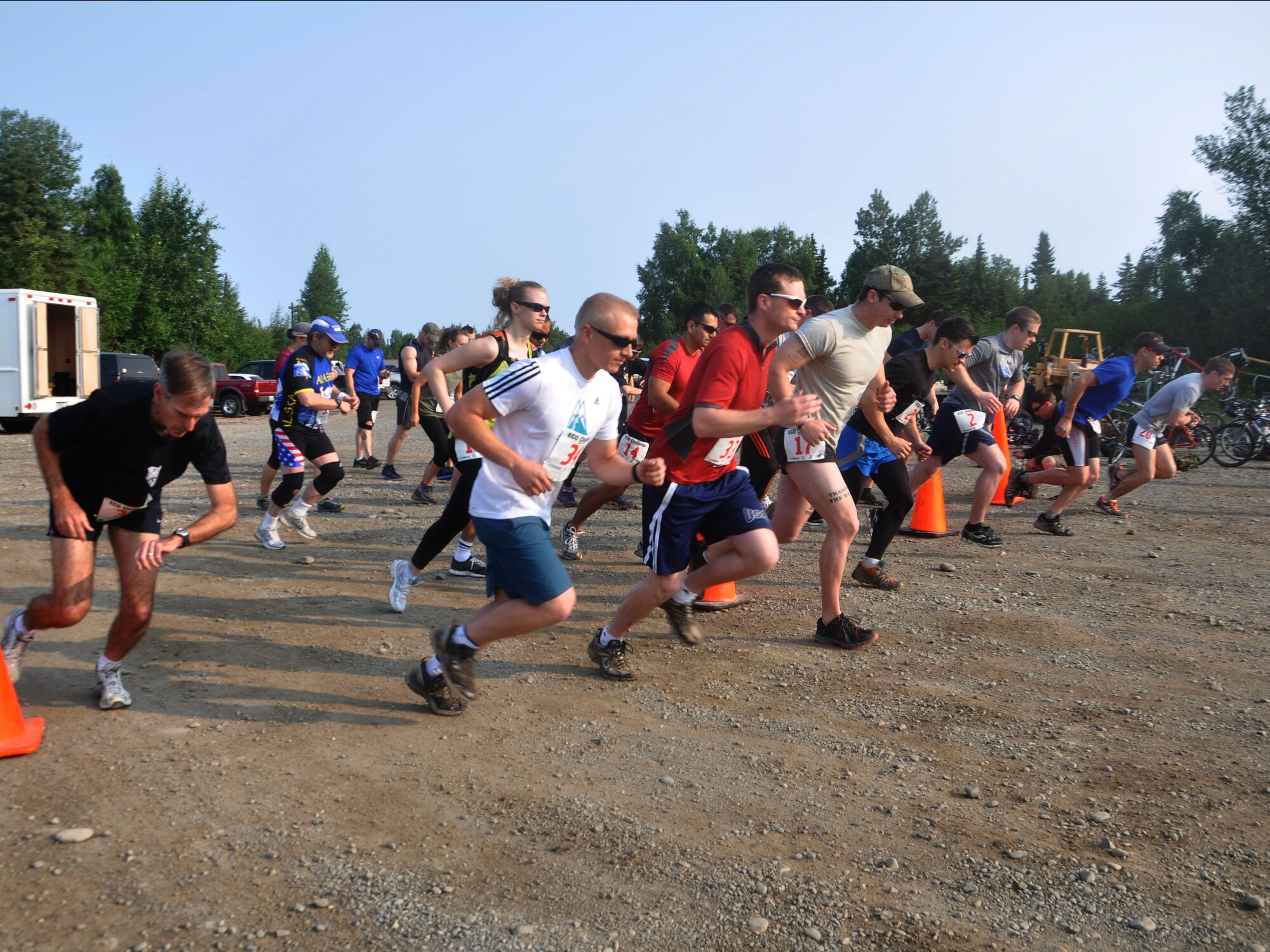 JOINT BASE ELMENDORF-RICHARDSON -- Military and community members sprinted across the starting line of the Eco Challenge here July 20. The Eco Challenge is an annual, multi-sport event hosted by the base fitness centers. National Guard photo by Staff Sgt. N. Alicia Goldberger.