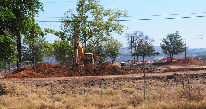 An employee of Balfour Beatty operates a excavator at Beale Air Force Base Calif., July 26, 2012. Balfour Beatty's privatization project is building new homes for the more than 300 families that live on base. (U.S. Air Force photo by Senior Airman Allen Pollard)