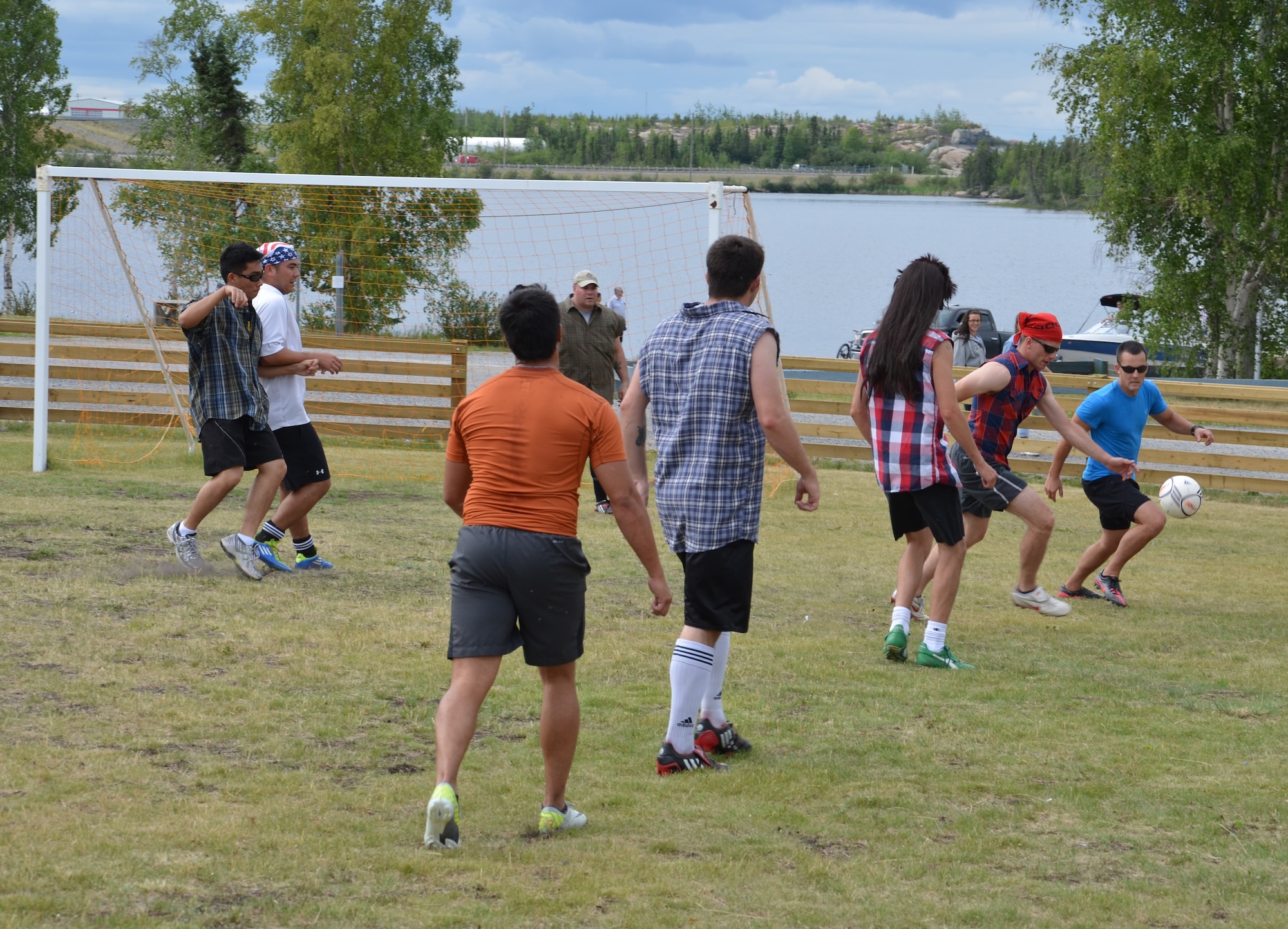 Airmen from the 920th Rescue Wing and Canadian forces from 440 Transport Squadron and 435 Transport and Rescue Squadron enjoy some friendly competition during a soccer game in Yellowknife, Canada, July 18, 2012, following a search-and-rescue exercise. The 920th RQW Patrick Air Force Base, Fla., participates in three exercises with Canadian search-and-rescue personnel annually. (U.S. Air Force photo/Staff Sgt. Anna-Marie Wyant)