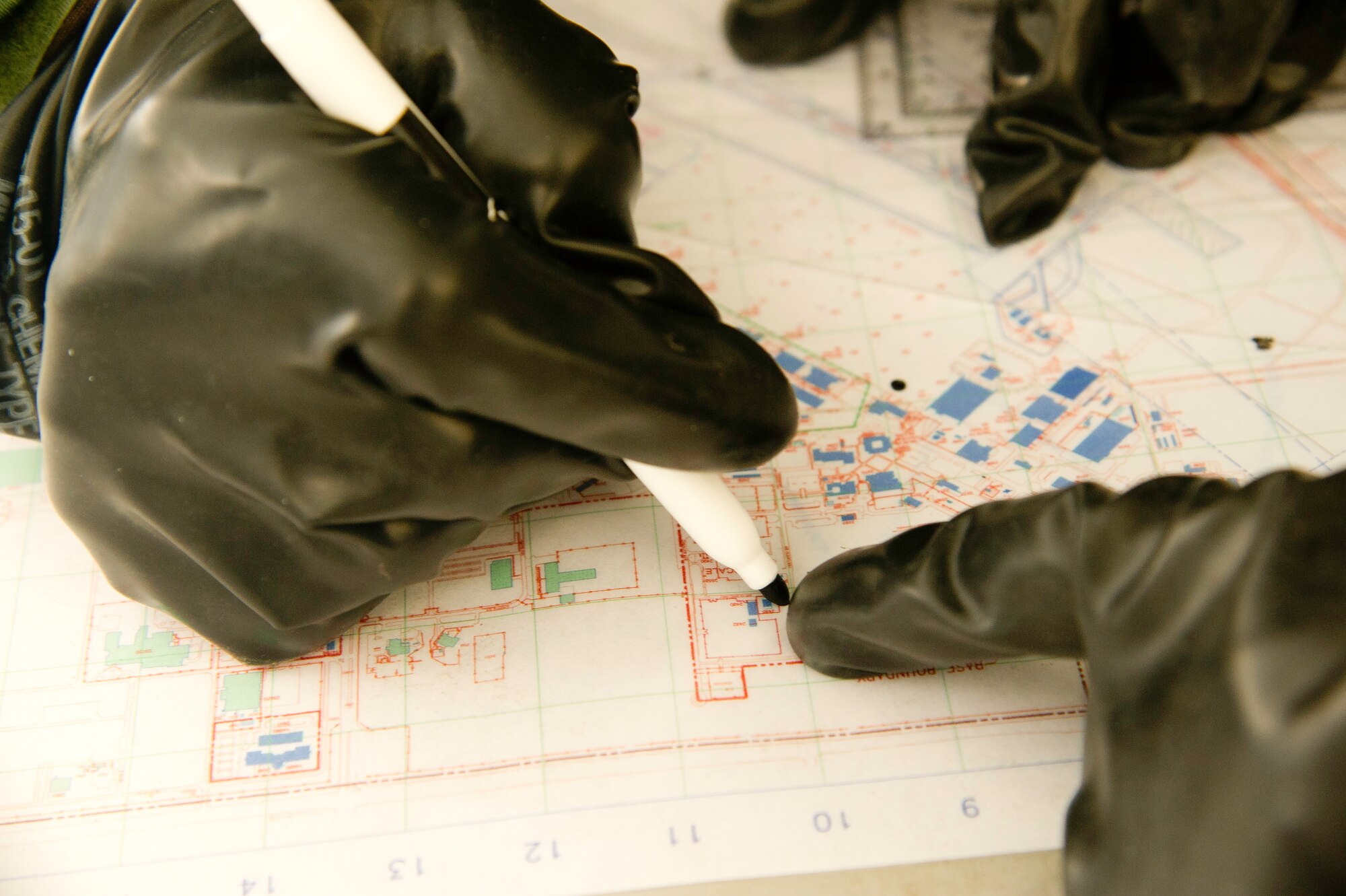 Airmen practice map reading while wearing mission operating protective posture
gear, level four, during an ATSO rodeo. (U.S. Air Force photo by Staff Sgt. Matthew Smith)